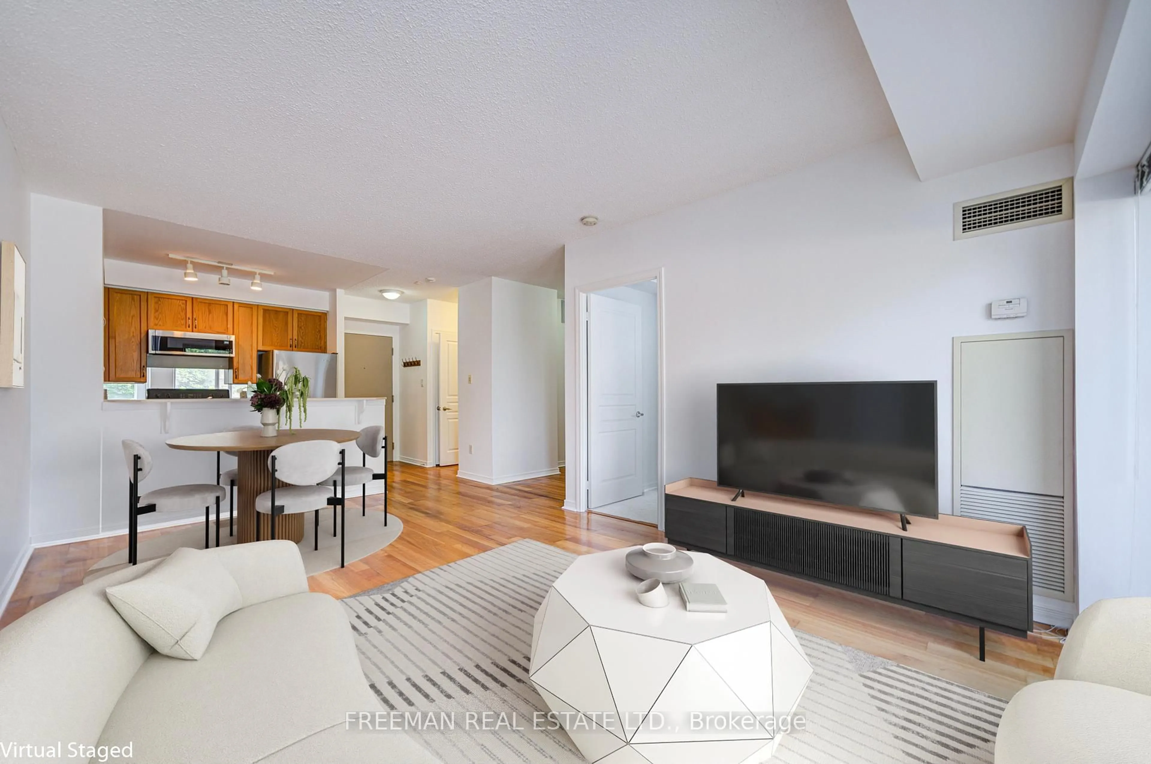 Living room with furniture, wood/laminate floor for 2495 Dundas St #221, Toronto Ontario M6P 1X4