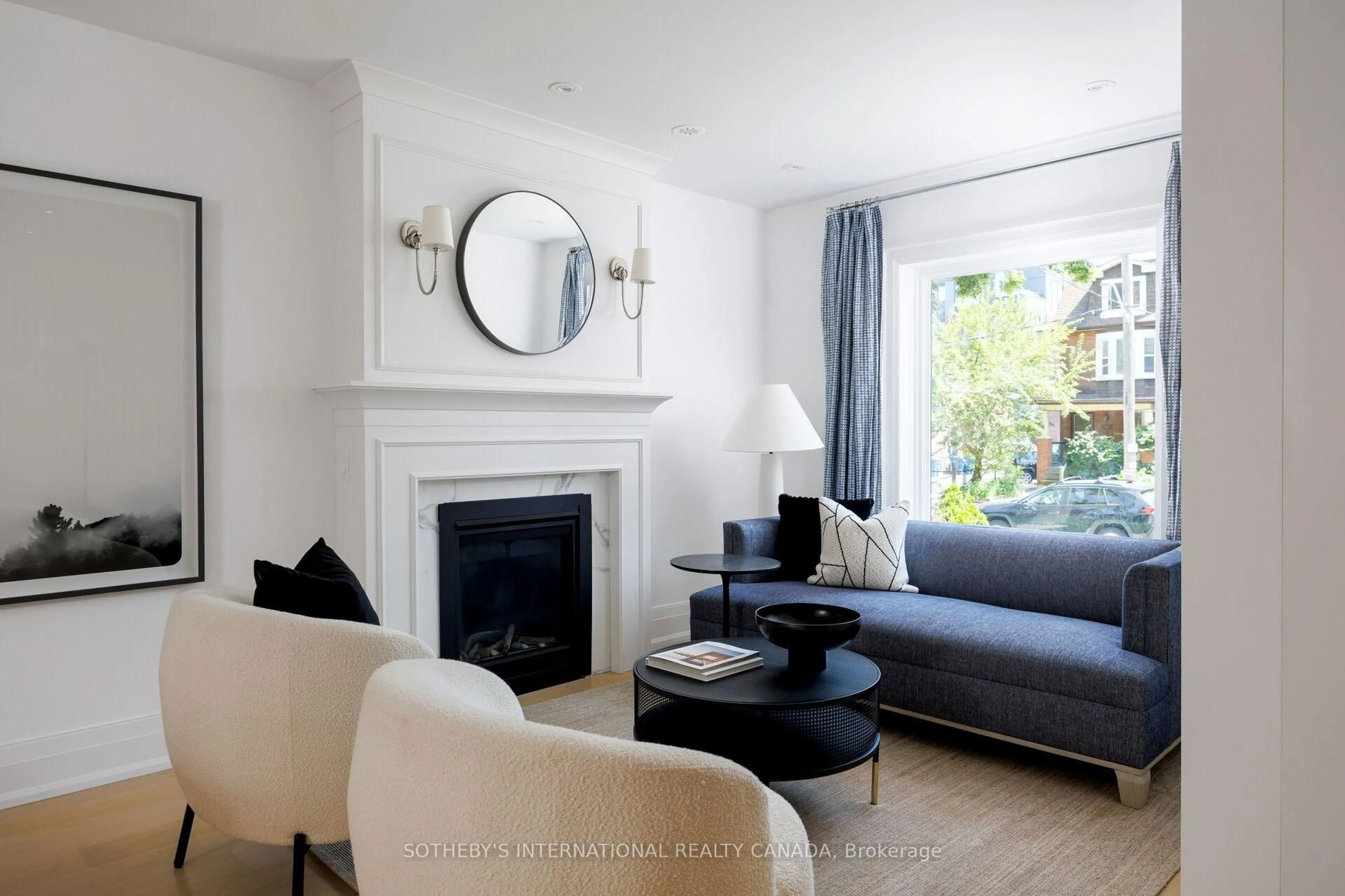 Living room with furniture, wood/laminate floor for 12 Hewitt Ave, Toronto Ontario M6R 1Y3