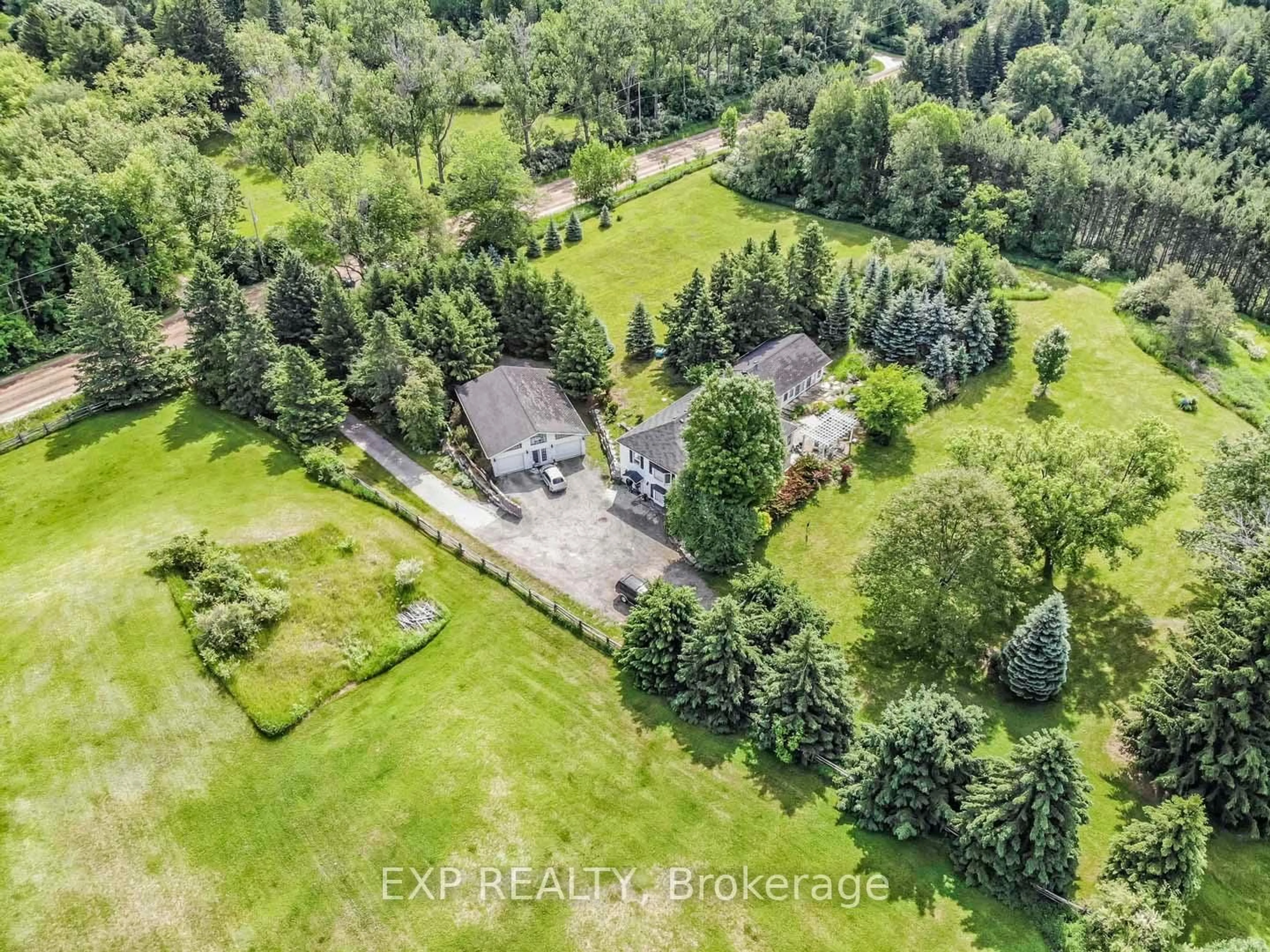 A pic from outside/outdoor area/front of a property/back of a property/a pic from drone, forest/trees view for 18862 Centreville Creek Rd, Caledon Ontario L7K 2M9