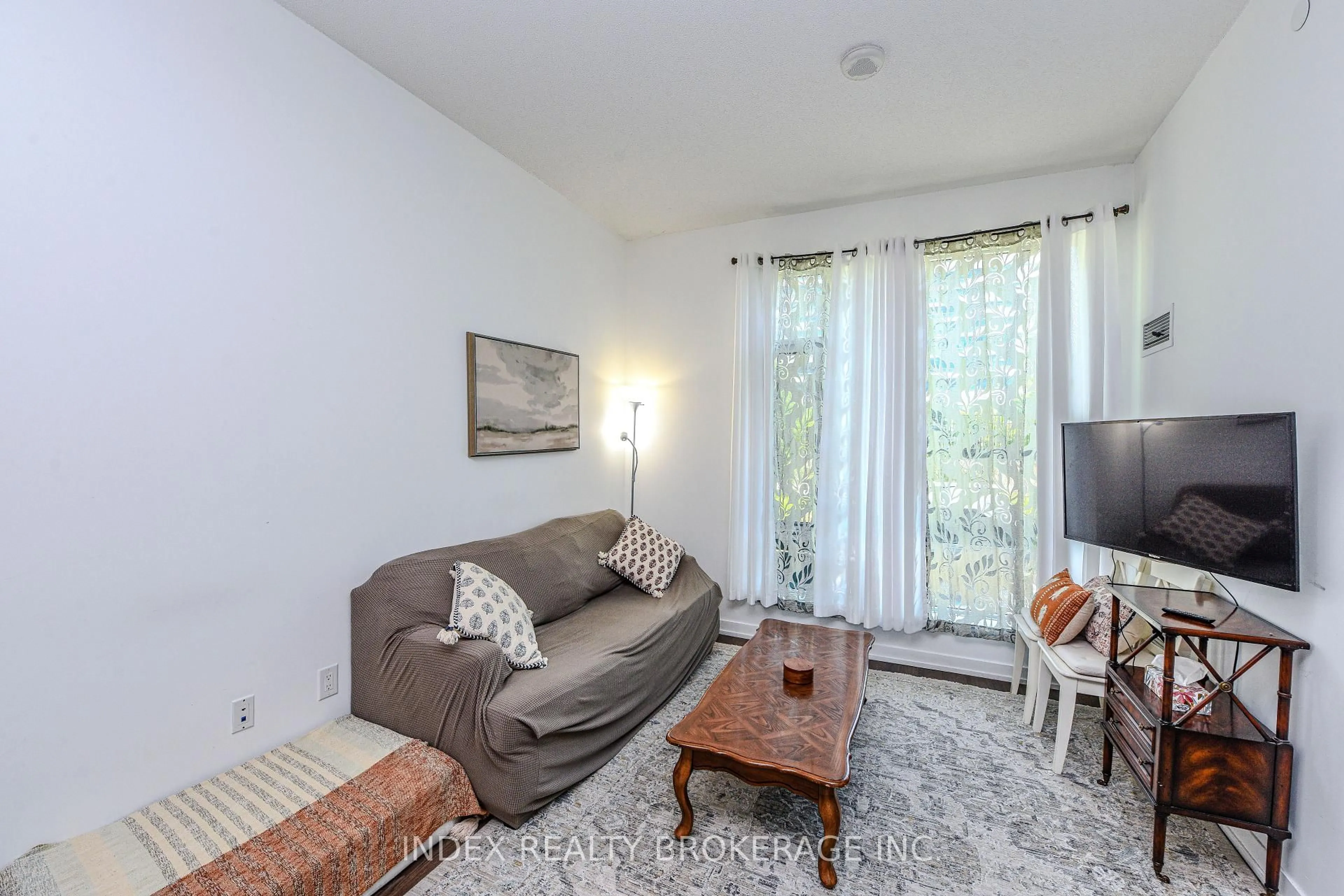 Living room with furniture, unknown for 2560 Eglington Ave #103, Mississauga Ontario L5M 0Y3