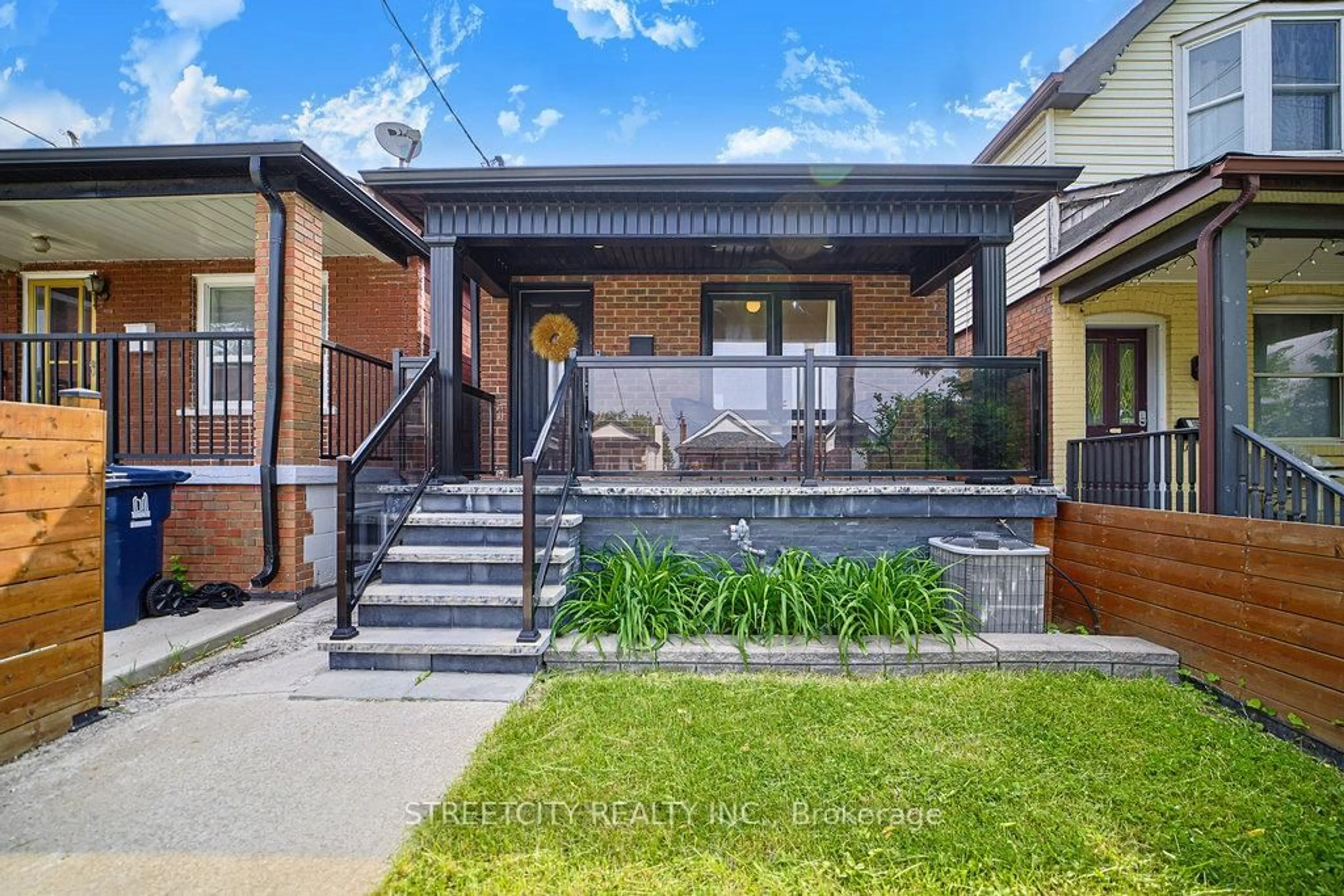 Home with brick exterior material, street for 409 Mcroberts Ave, Toronto Ontario M6E 4R1