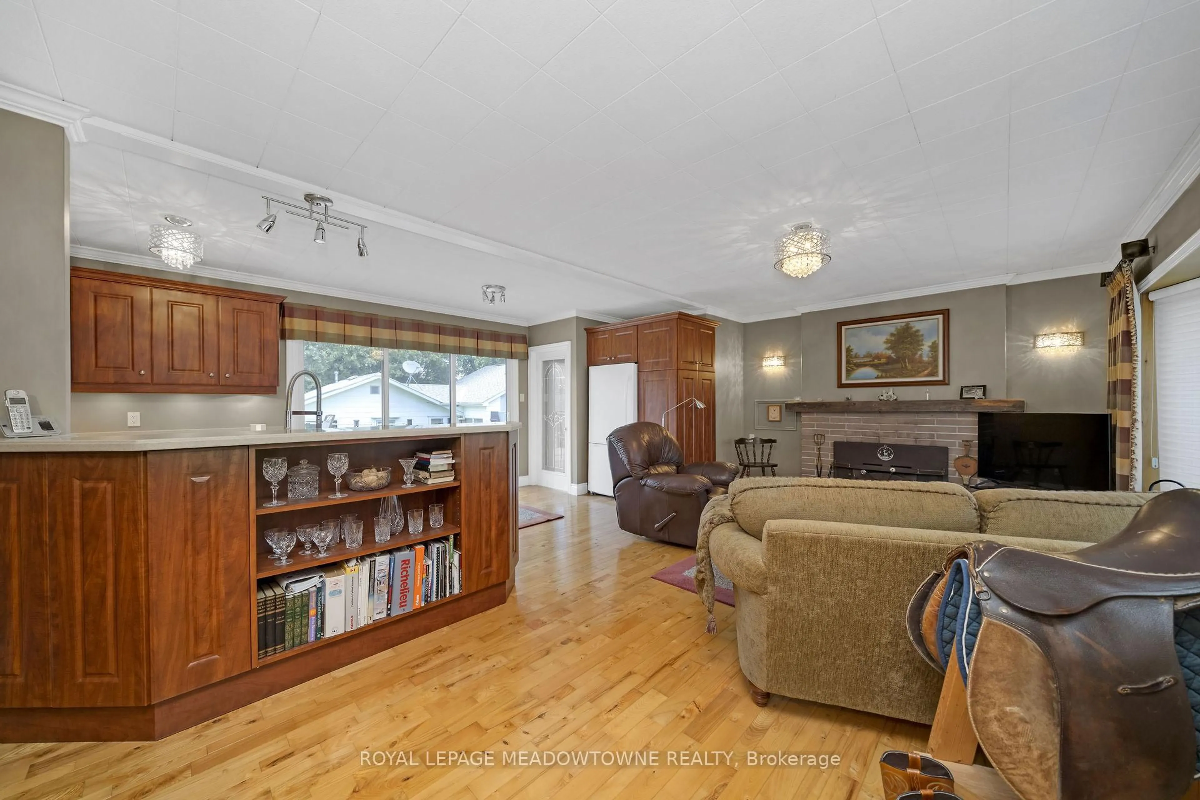 Living room with furniture, wood/laminate floor for 13181 Hwy 7, Halton Hills Ontario L7G 4S4