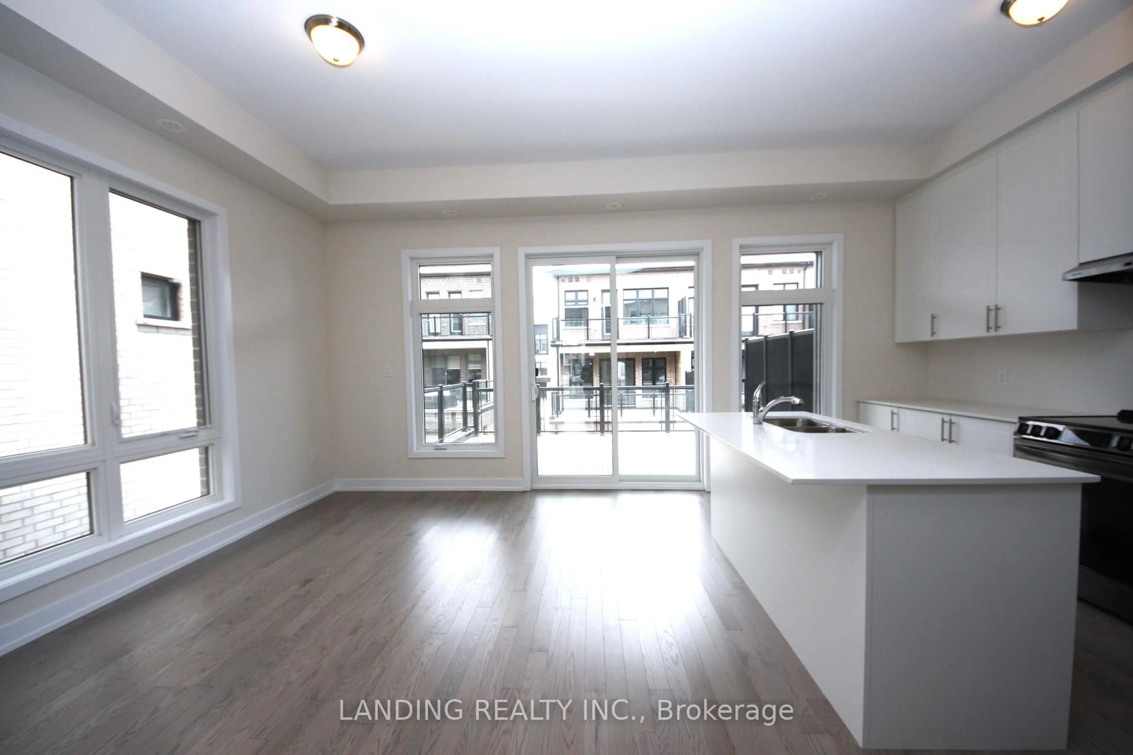 Open concept kitchen, wood/laminate floor for 3057 Welsman Gdns, Oakville Ontario L6H 7Z2