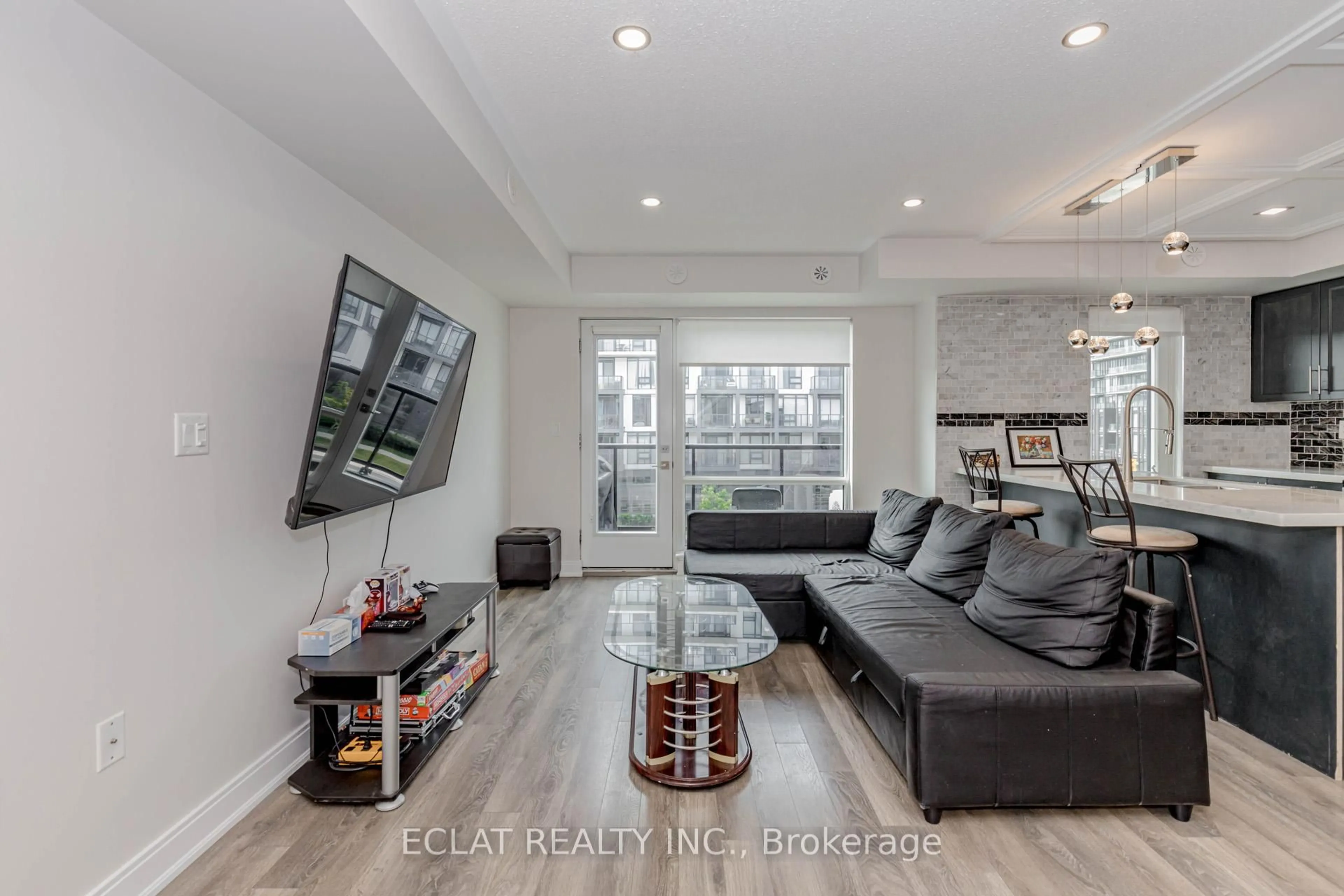 Living room with furniture, unknown for 100 Dufay Rd #100, Brampton Ontario L7A 4S3