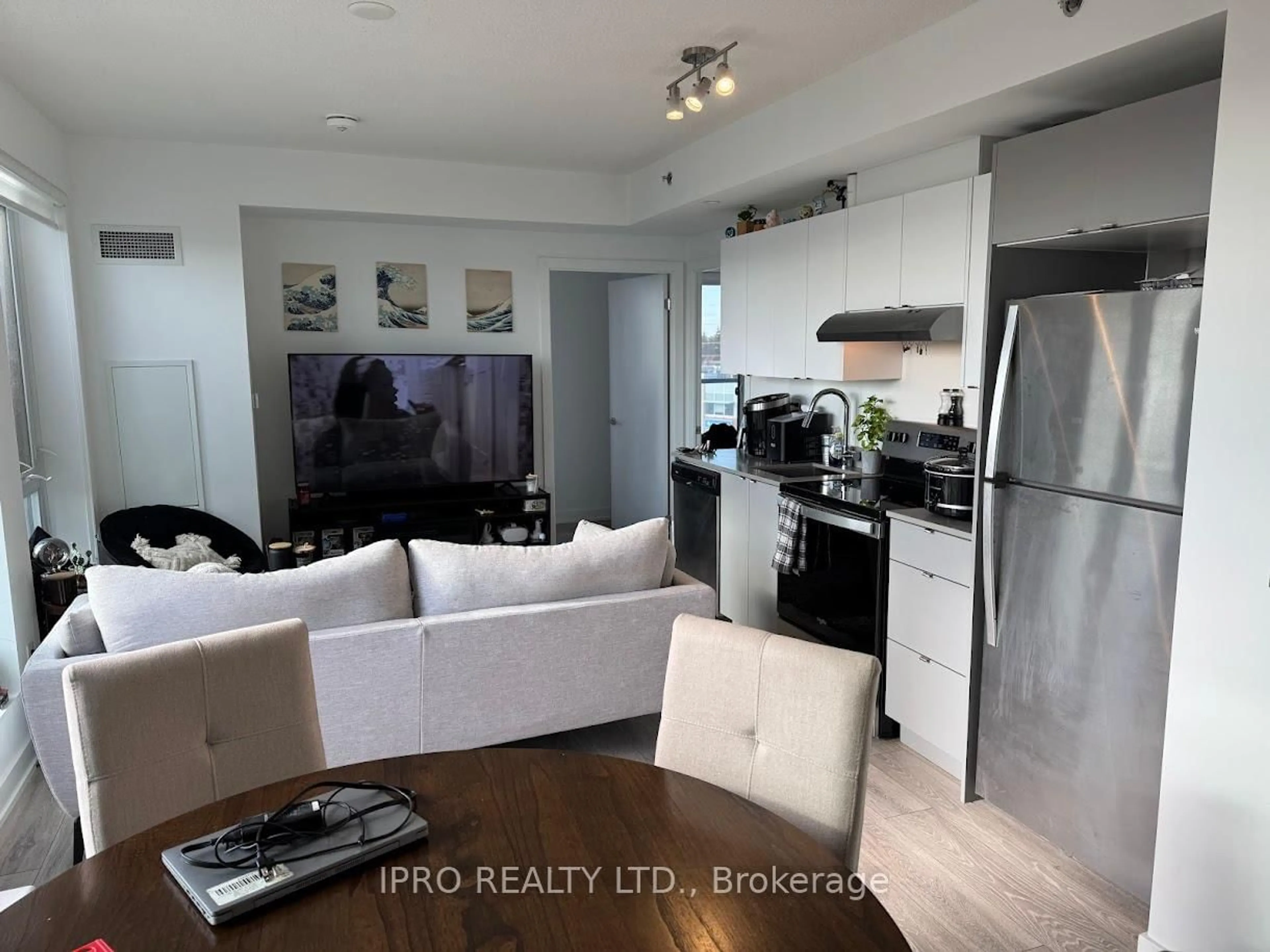 Open concept kitchen, wood/laminate floor for 3200 Dakota Common #A507, Burlington Ontario L7M 2A8