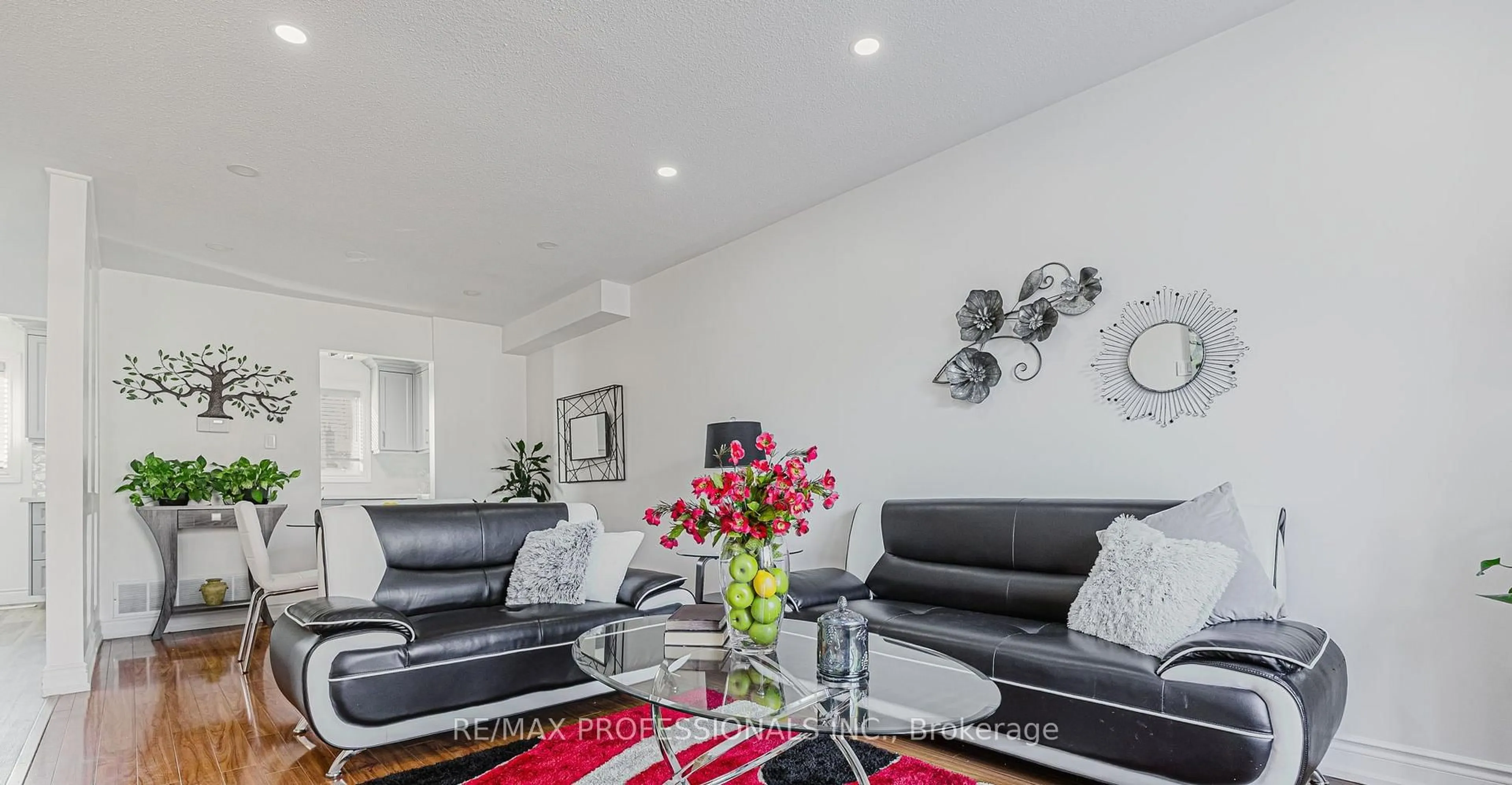 Living room with furniture, wood/laminate floor for 2416 Malcolm Cres, Burlington Ontario L7P 3Y4