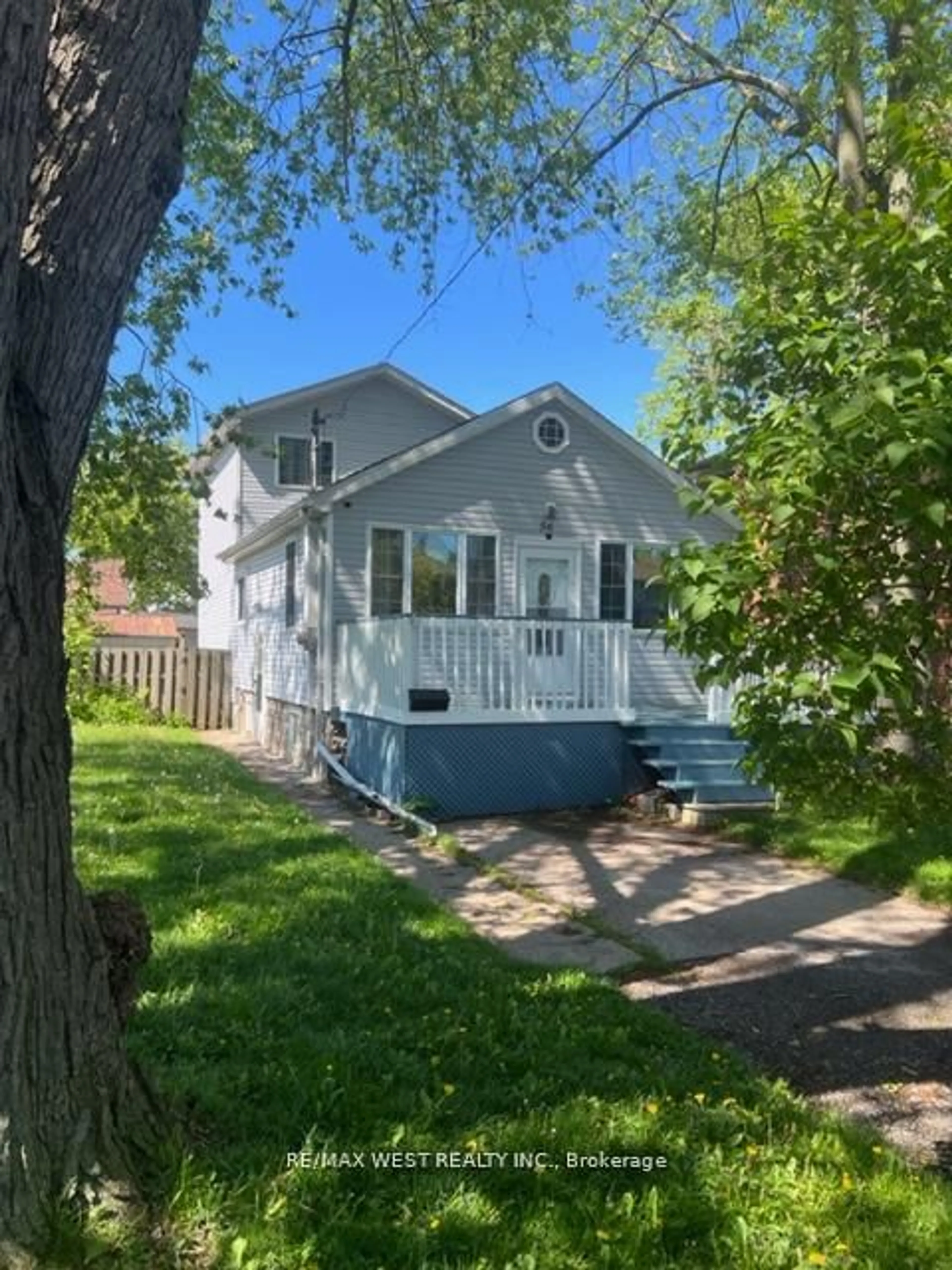 Home with vinyl exterior material, street for 56 Forty First St, Toronto Ontario M8W 3N6