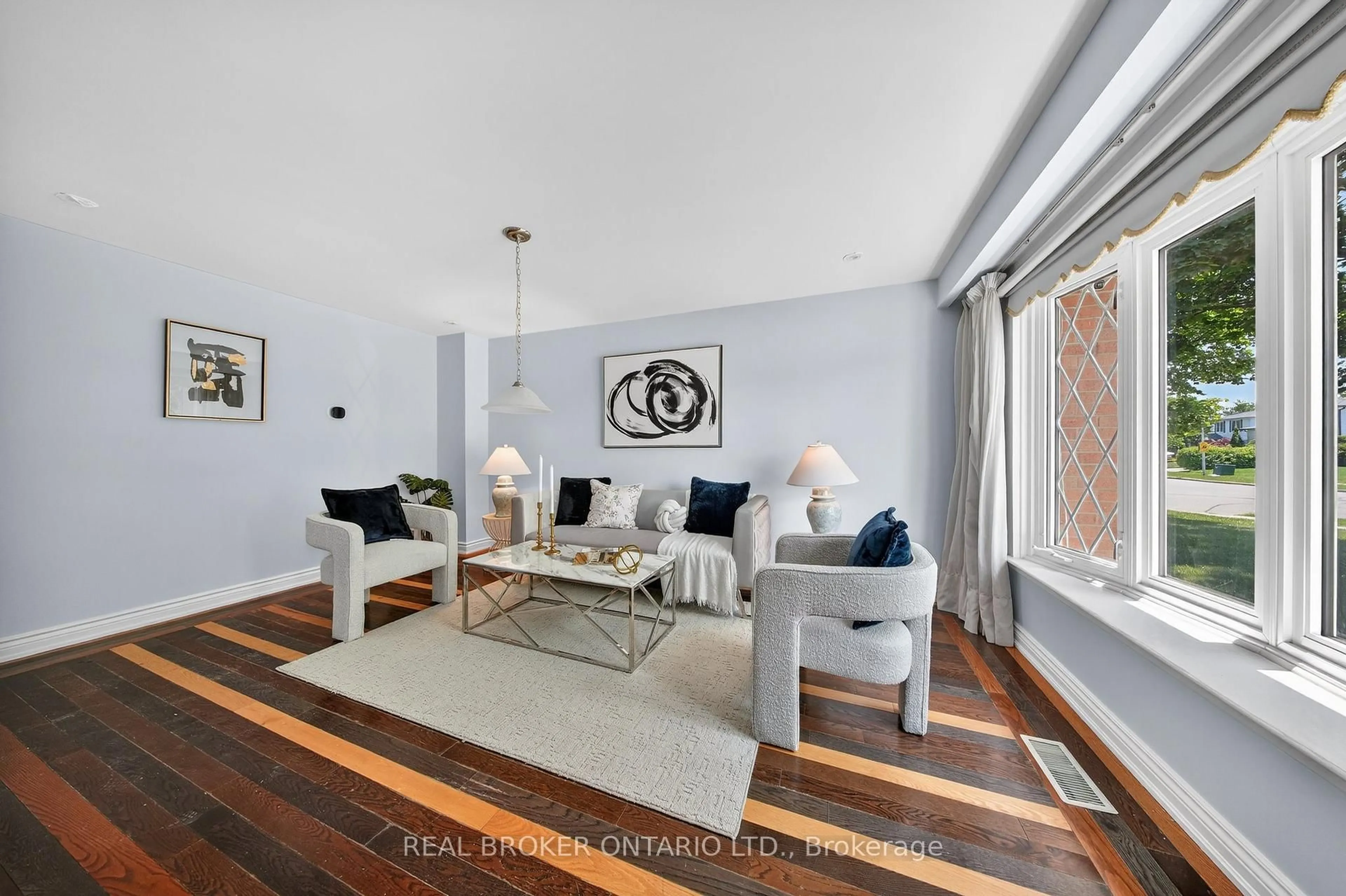Living room with furniture, wood/laminate floor for 34 Greenbriar Rd, Brampton Ontario L6S 1Z9