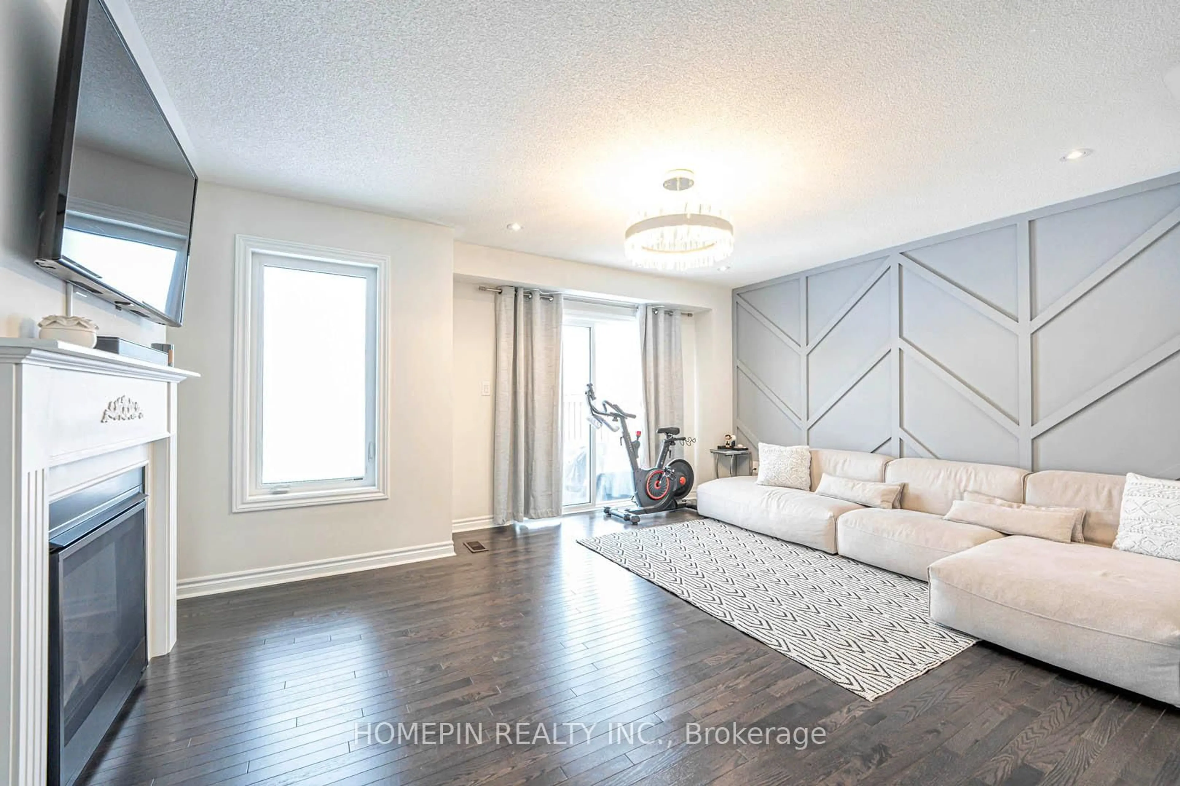 Living room with furniture, wood/laminate floor for 292 Fasken Crt, Milton Ontario L9T 6S9