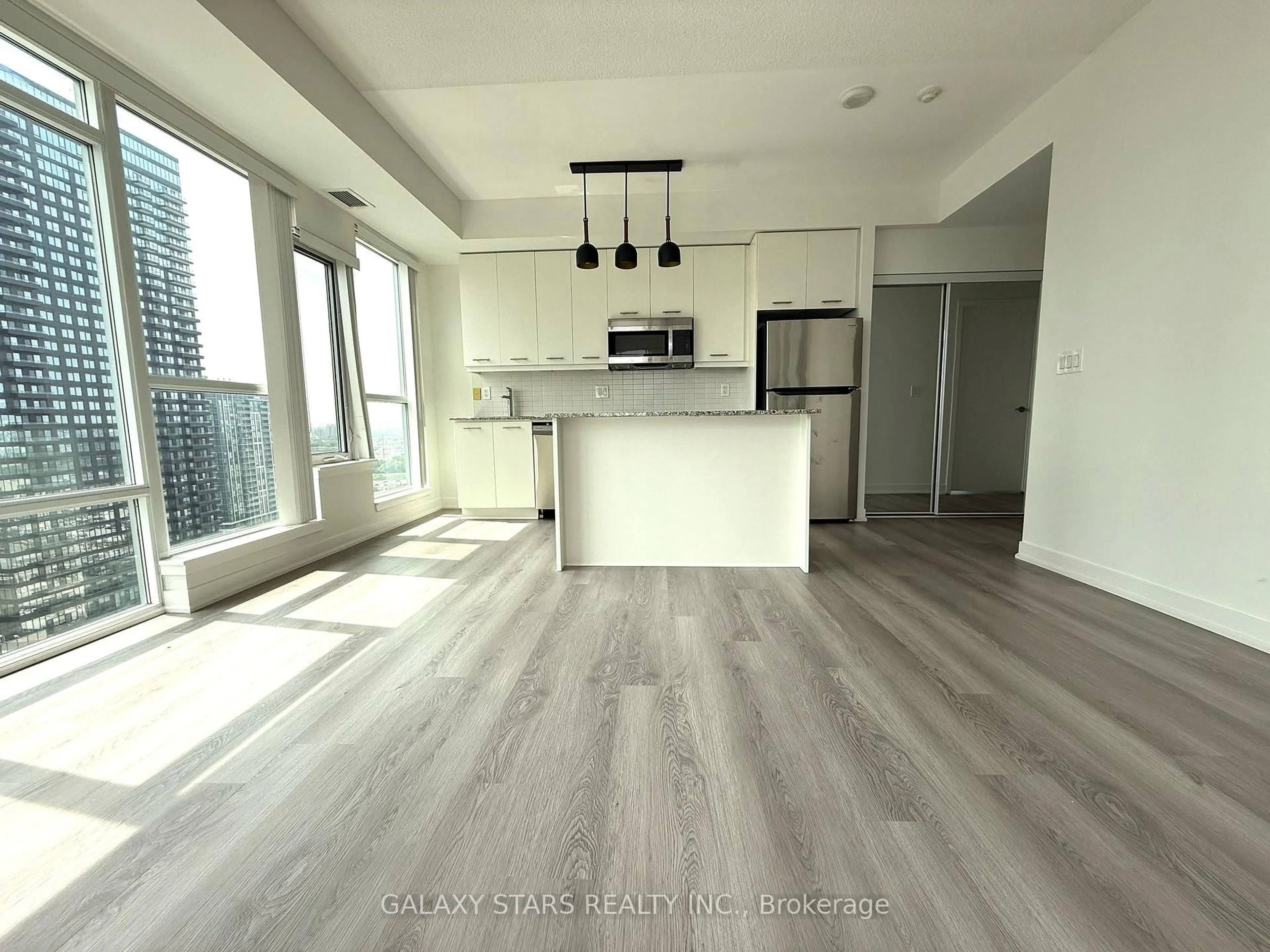 Open concept kitchen, wood/laminate floor for 360 Square One Dr #1905, Mississauga Ontario L5B 0G7