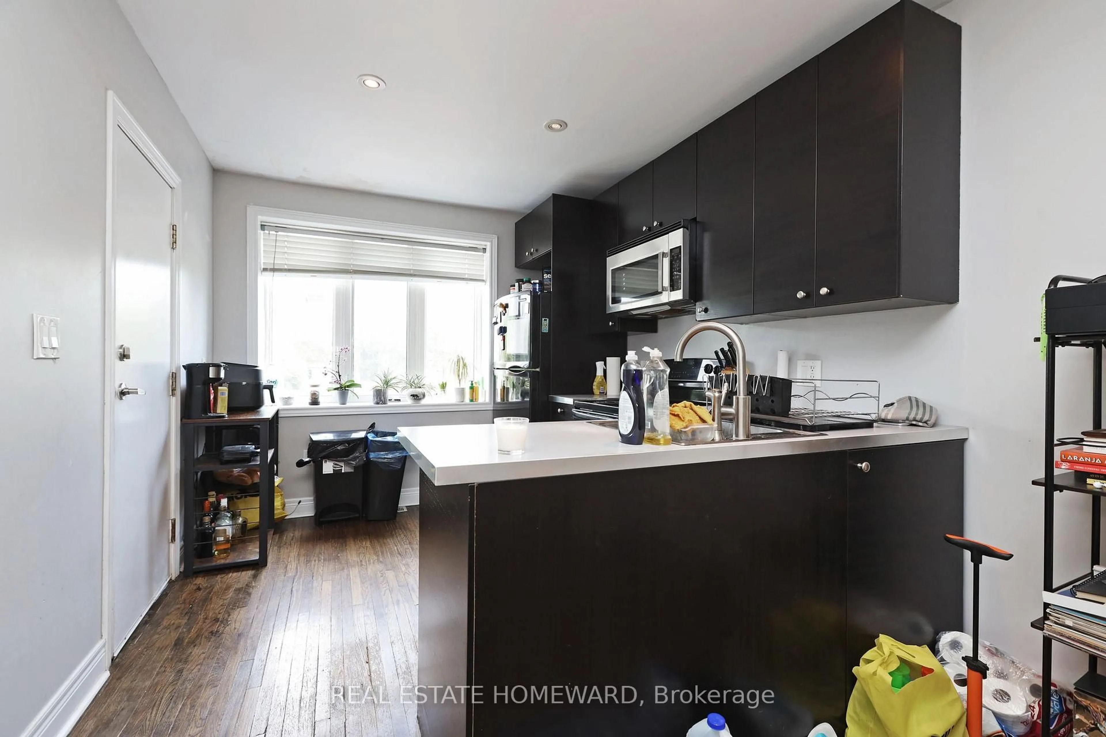 Open concept kitchen, wood/laminate floor for 156 Royal York Rd, Toronto Ontario M8V 2V3