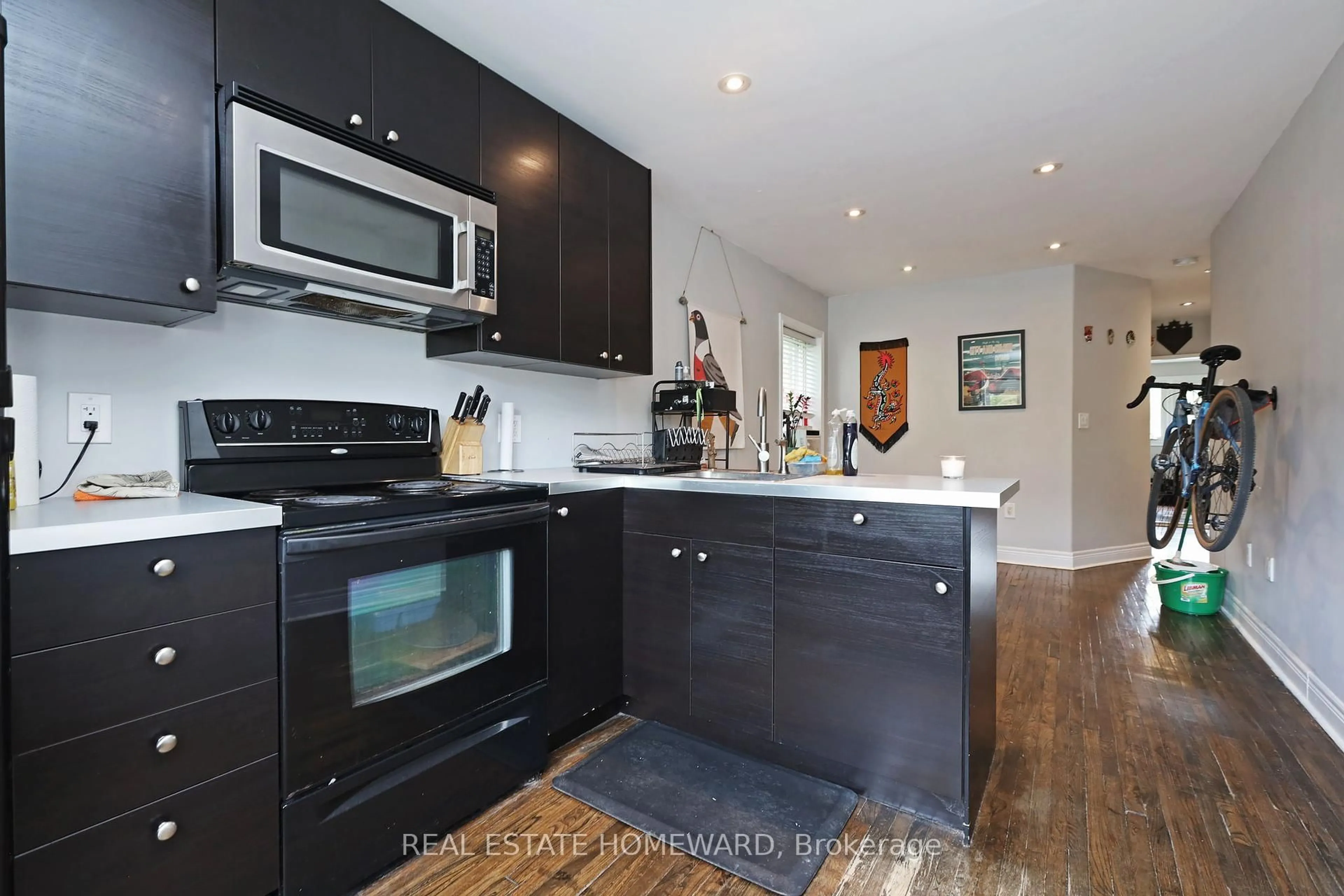 Open concept kitchen, wood/laminate floor for 156 Royal York Rd, Toronto Ontario M8V 2V3