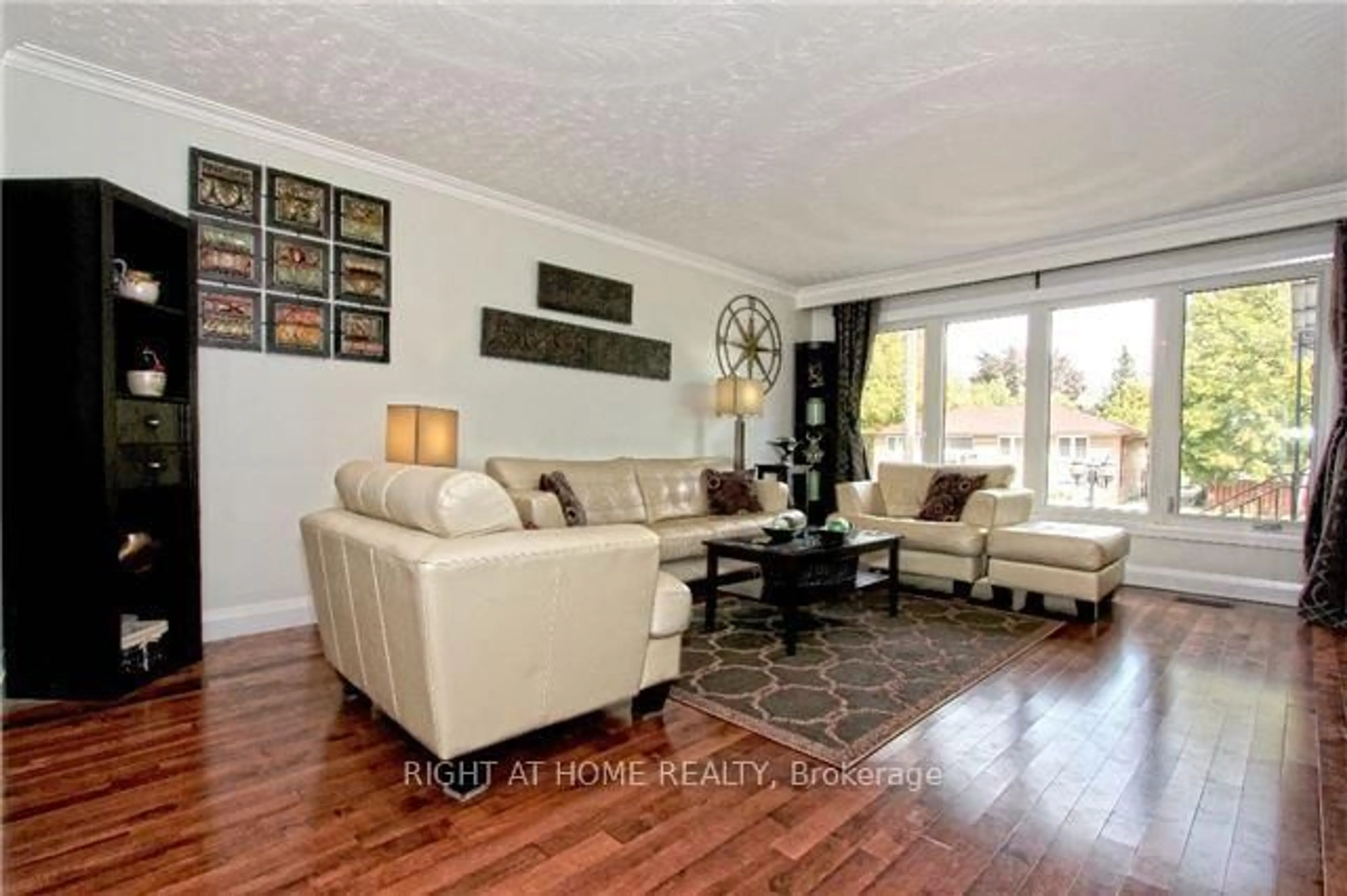 Living room with furniture, wood/laminate floor for 107 Alhart Dr, Toronto Ontario M9V 2N6
