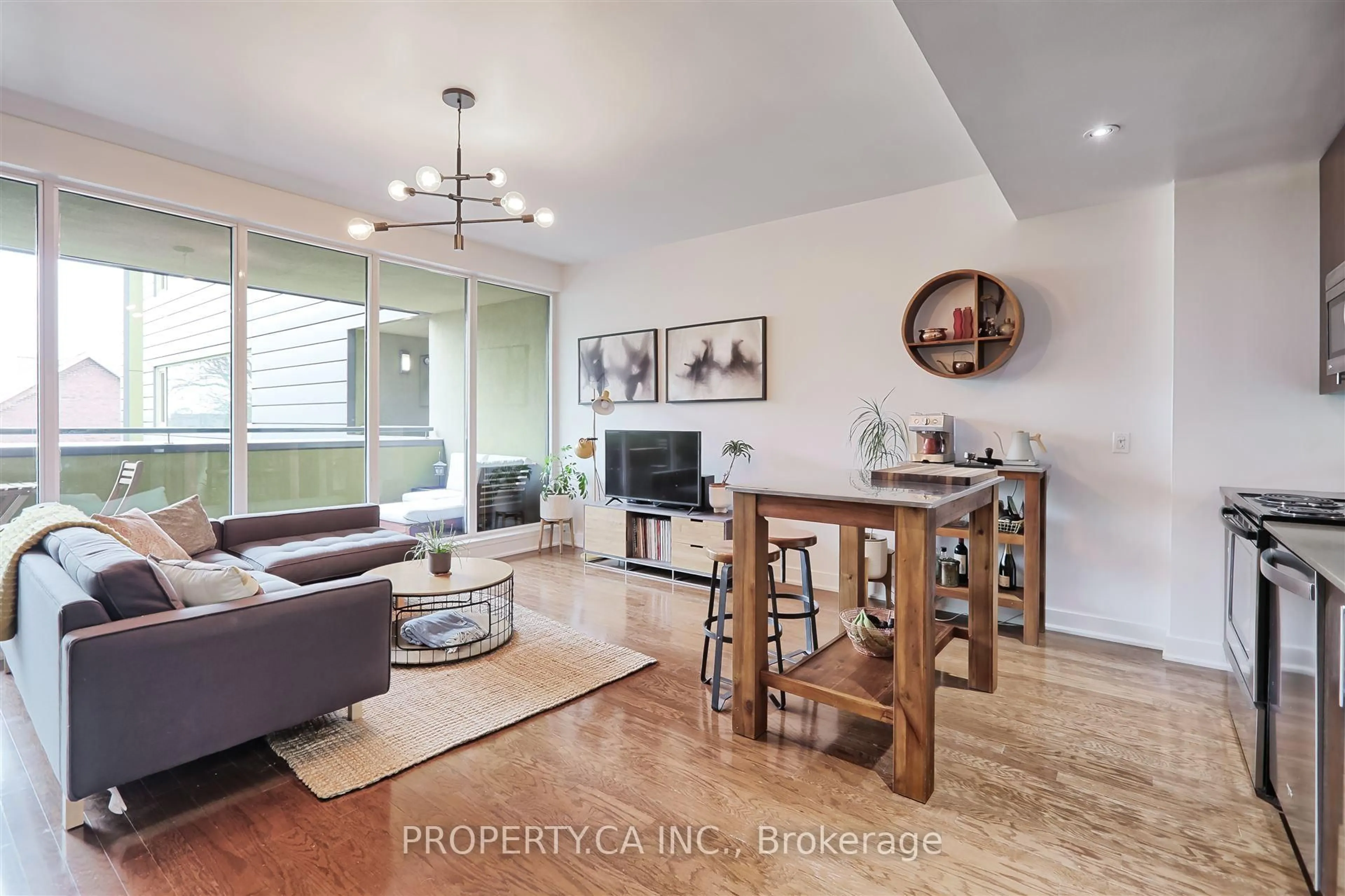 Living room with furniture, wood/laminate floor for 25 Ritchie Ave #303, Toronto Ontario M6R 2J6
