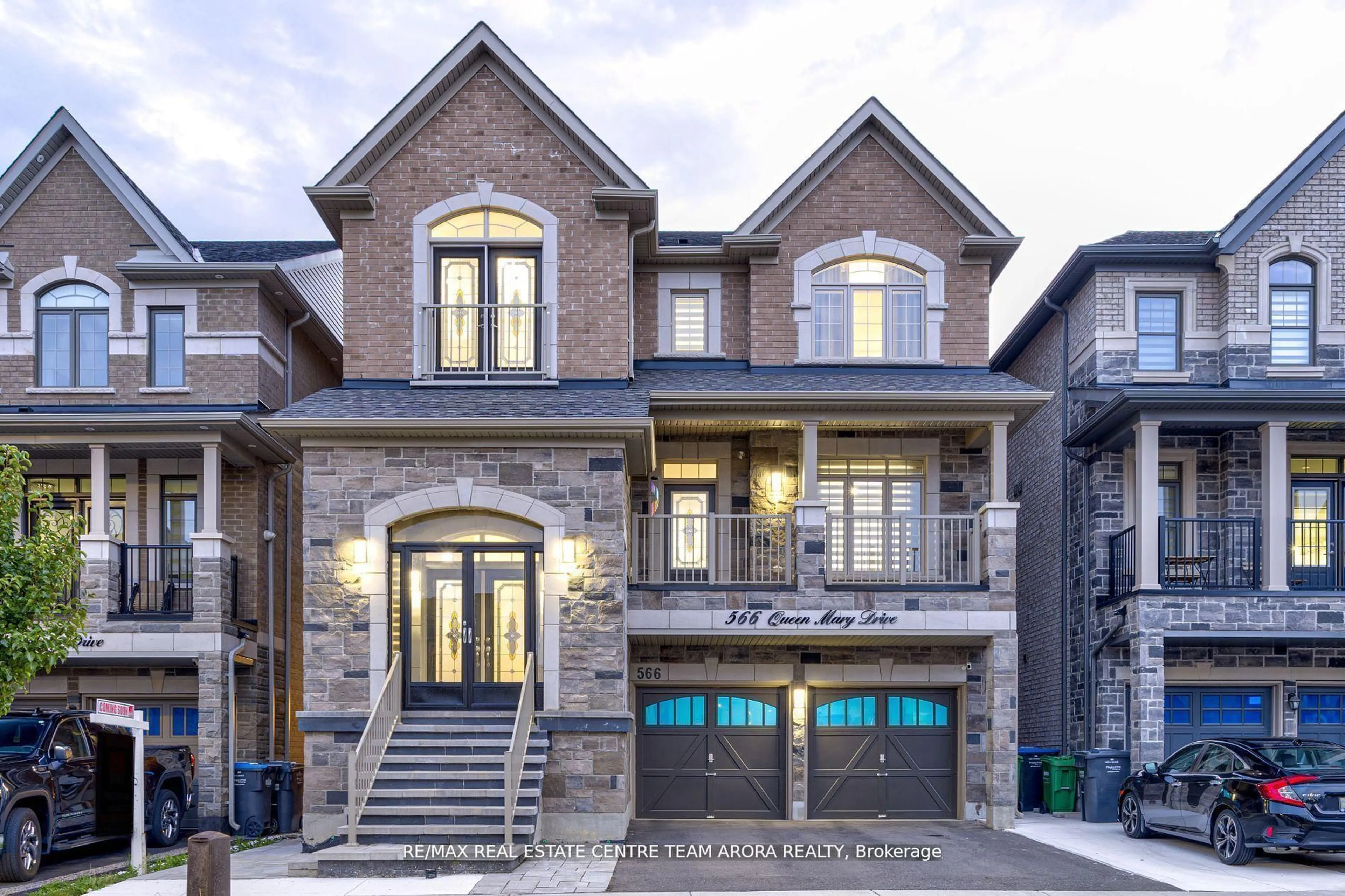 Home with brick exterior material, street for 566 Queen Mary Dr, Brampton Ontario L7A 4Y6