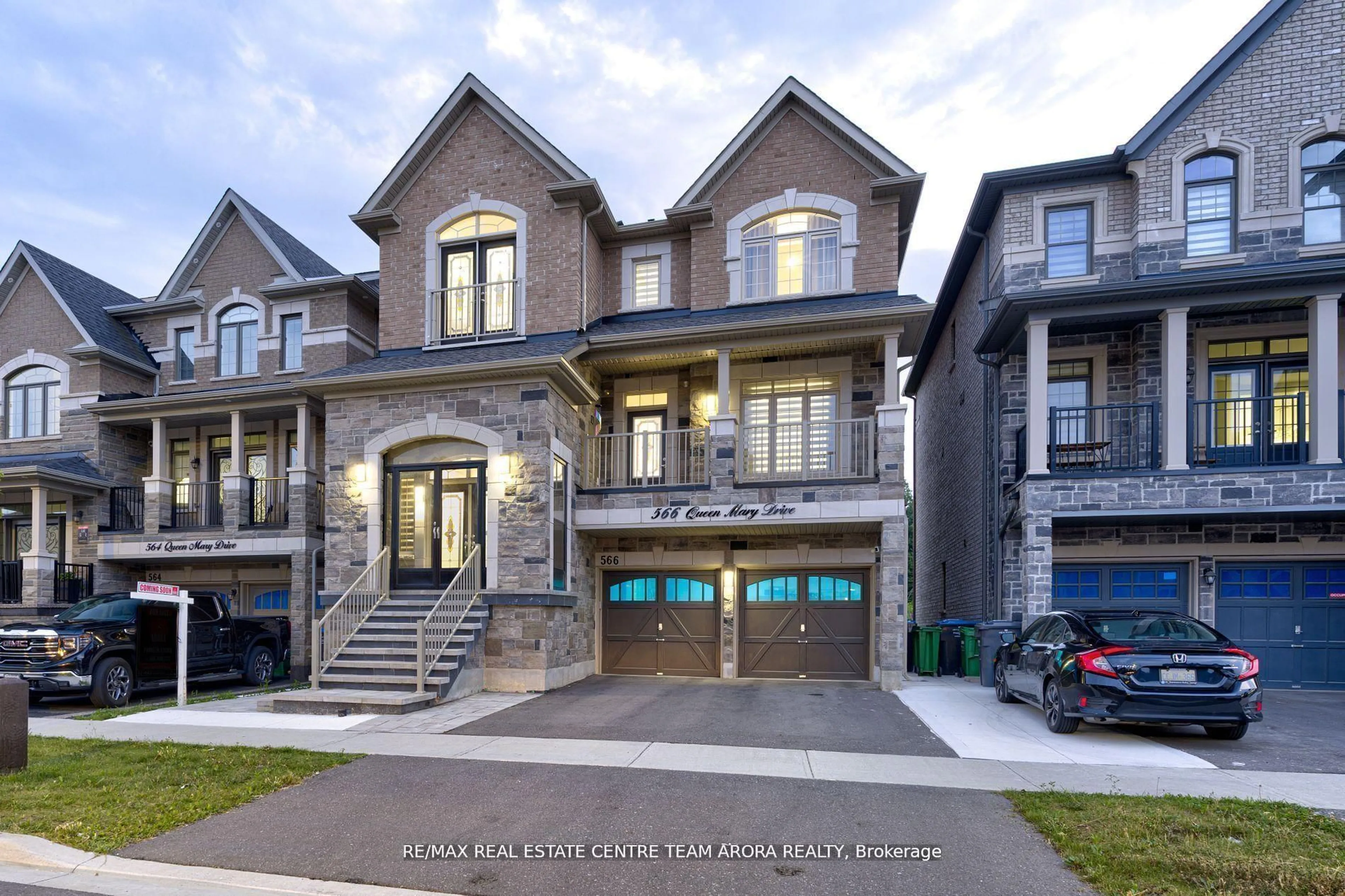 Home with brick exterior material, street for 566 Queen Mary Dr, Brampton Ontario L7A 4Y6