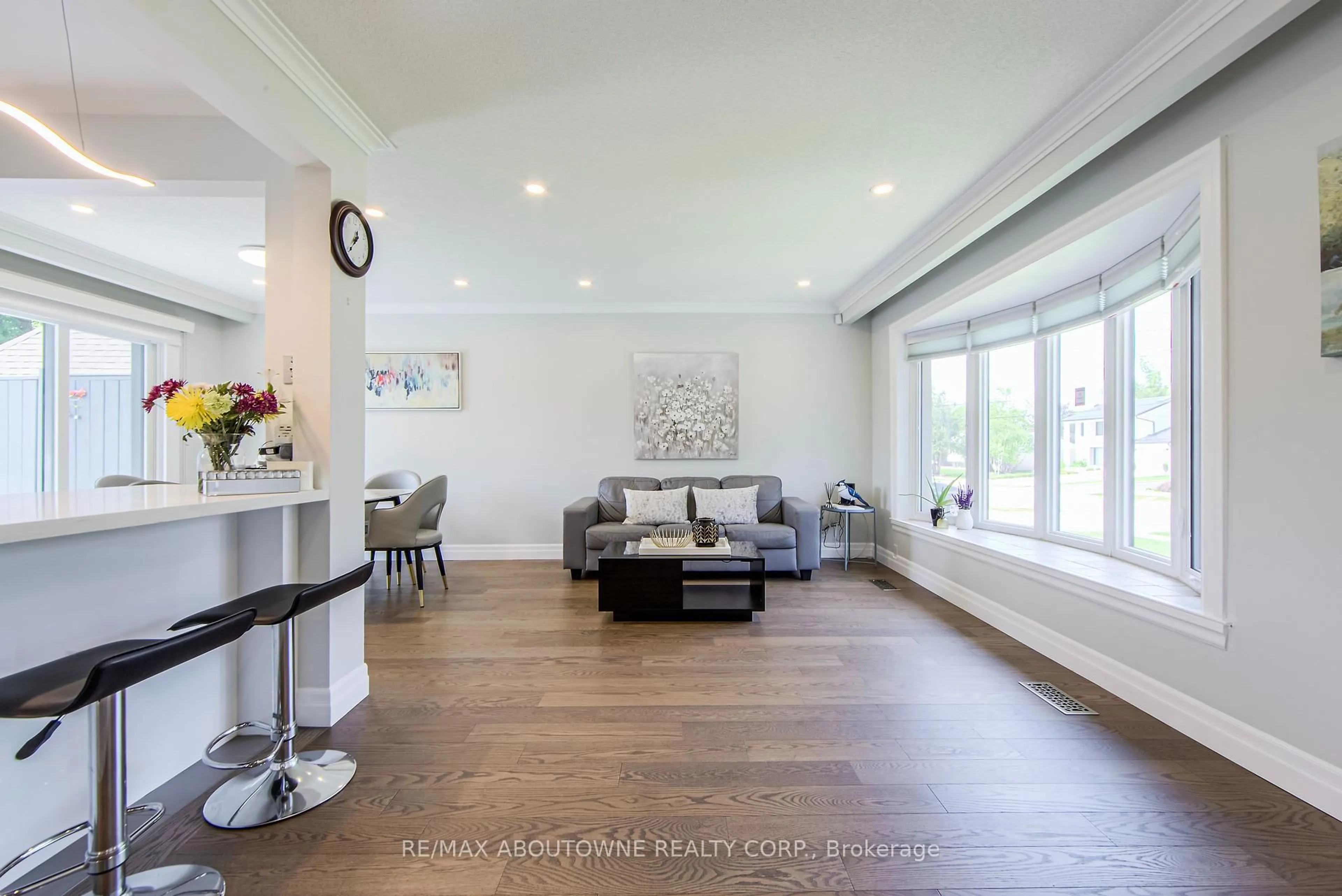 Living room with furniture, wood/laminate floor for 2122 Bridge Rd, Oakville Ontario L6L 2G1