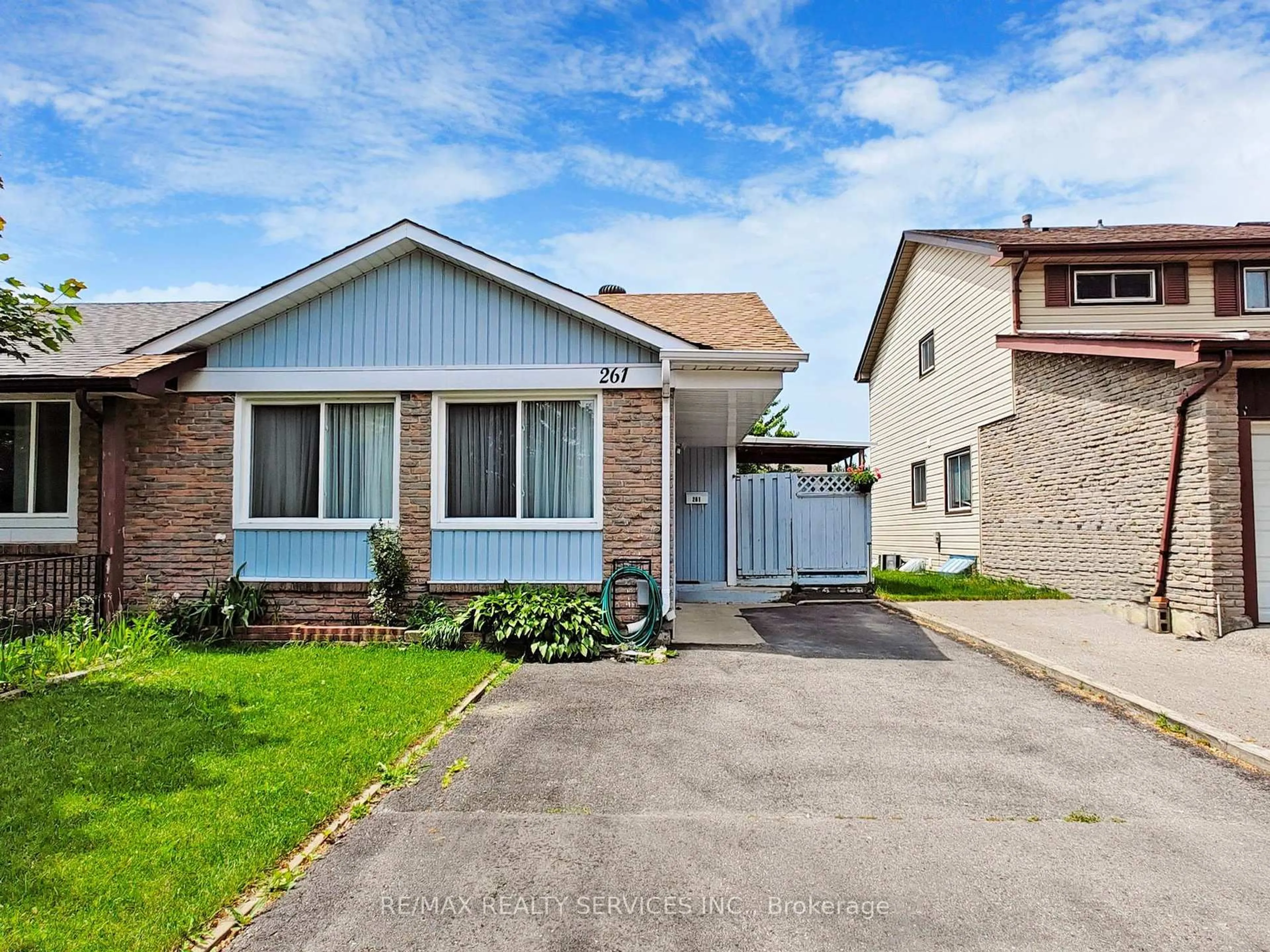 Home with vinyl exterior material, street for 261 Hansen Rd, Brampton Ontario L6V 2T5