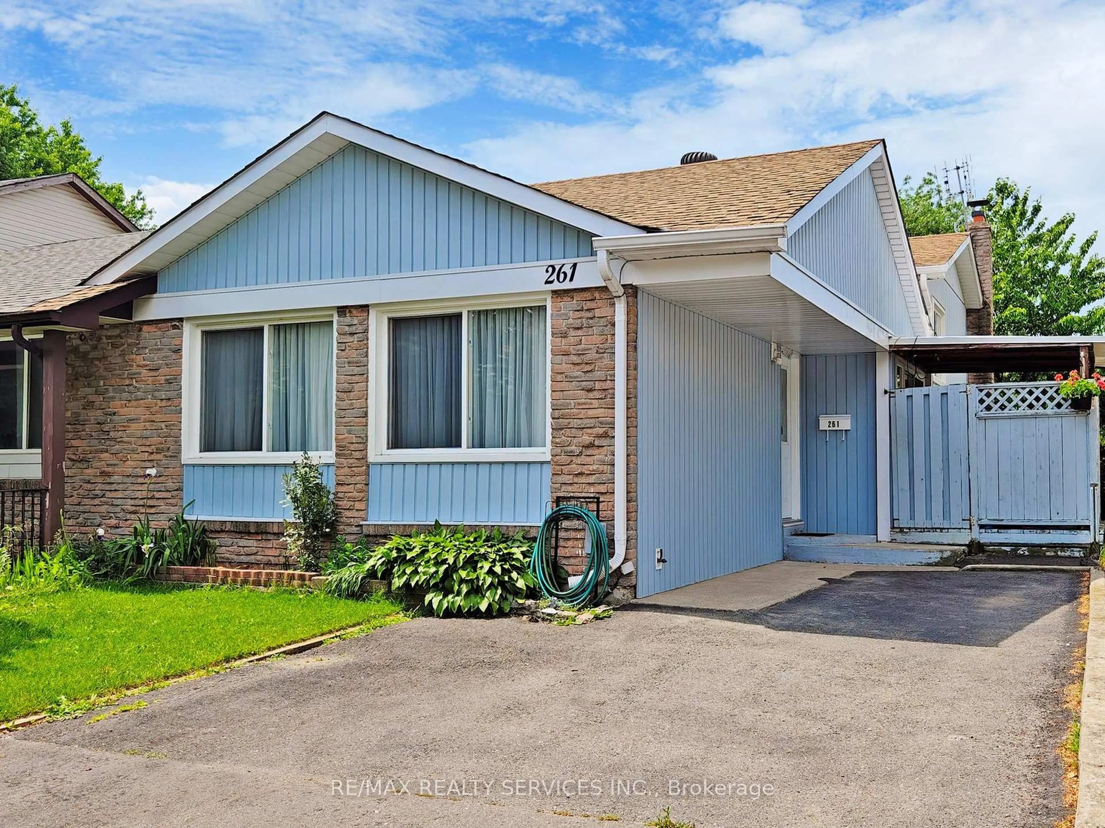 Home with vinyl exterior material, street for 261 Hansen Rd, Brampton Ontario L6V 2T5