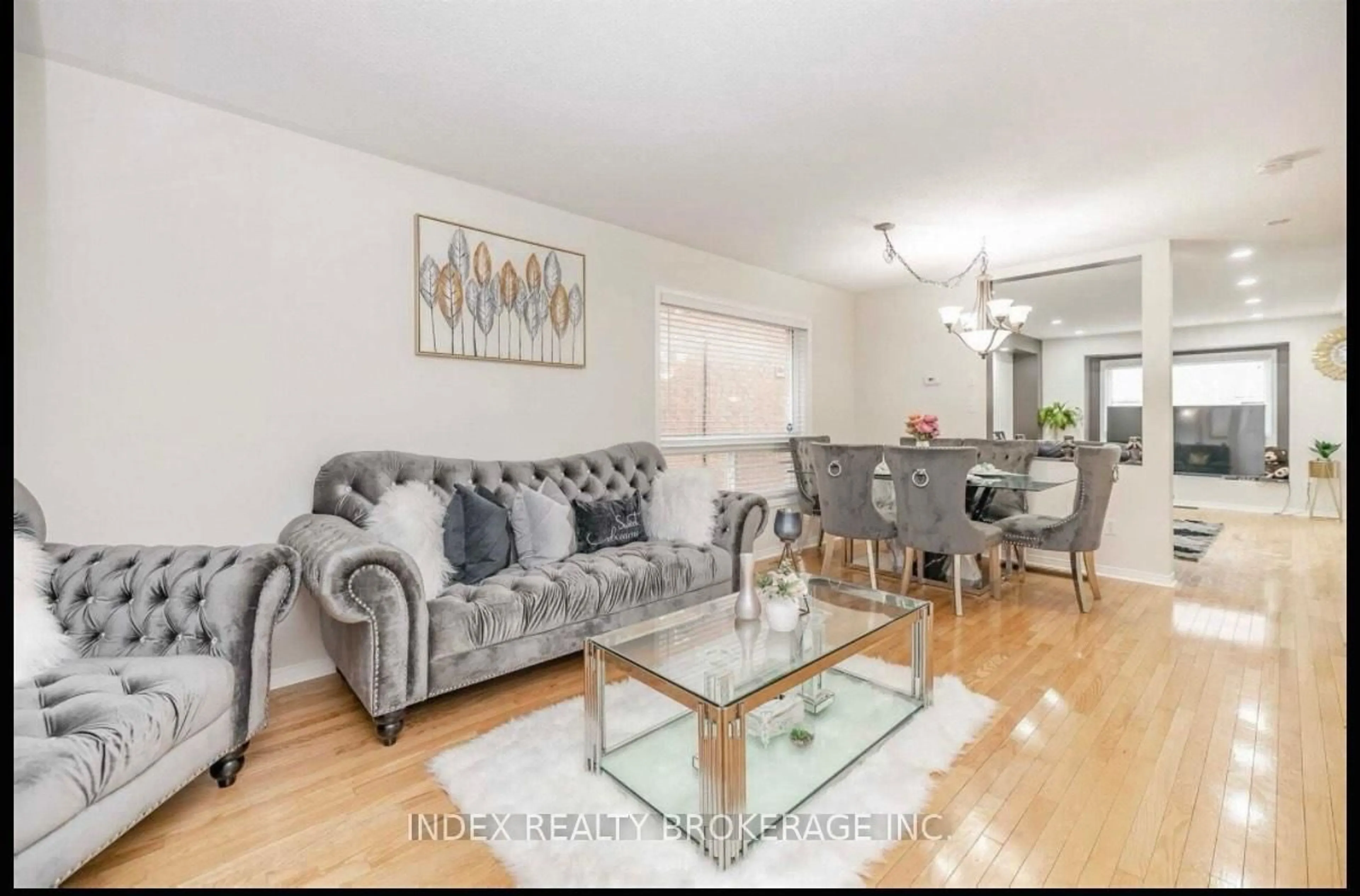 Living room with furniture, wood/laminate floor for 59 Spencer Dr, Brampton Ontario L7A 2A6