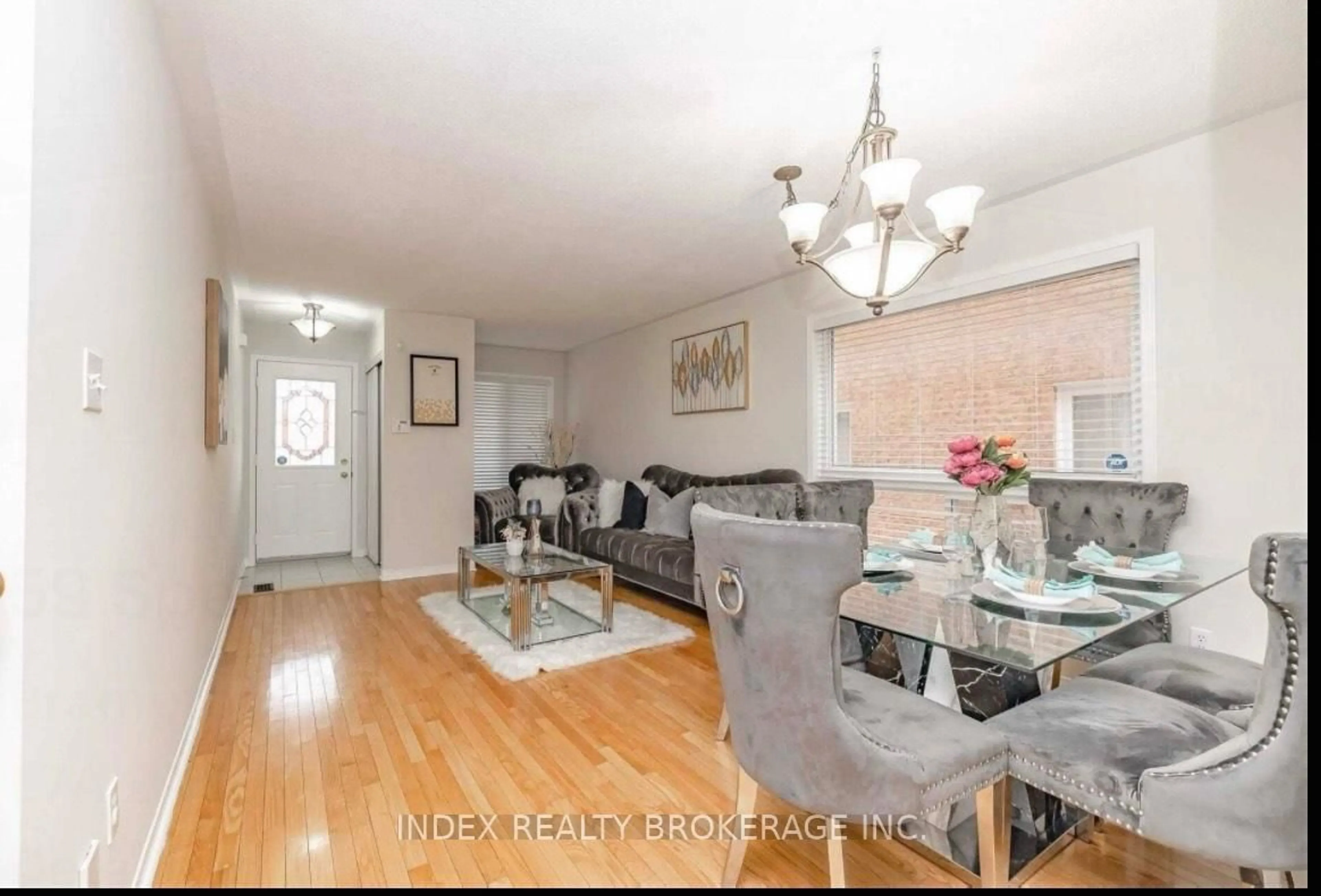 Living room with furniture, wood/laminate floor for 59 Spencer Dr, Brampton Ontario L7A 2A6