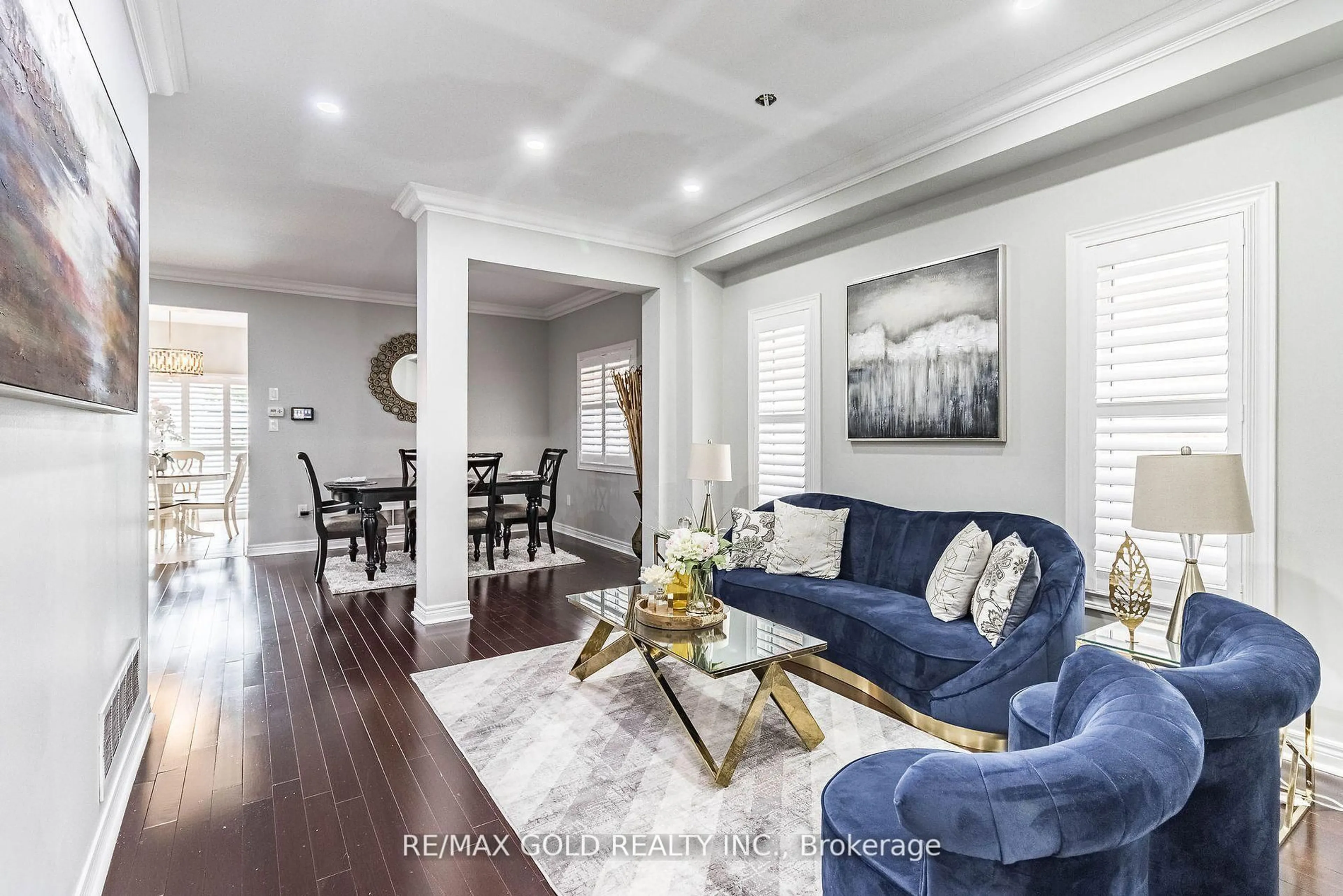 Living room with furniture, wood/laminate floor for 251 Father Tobin Rd, Brampton Ontario L6R 0N9