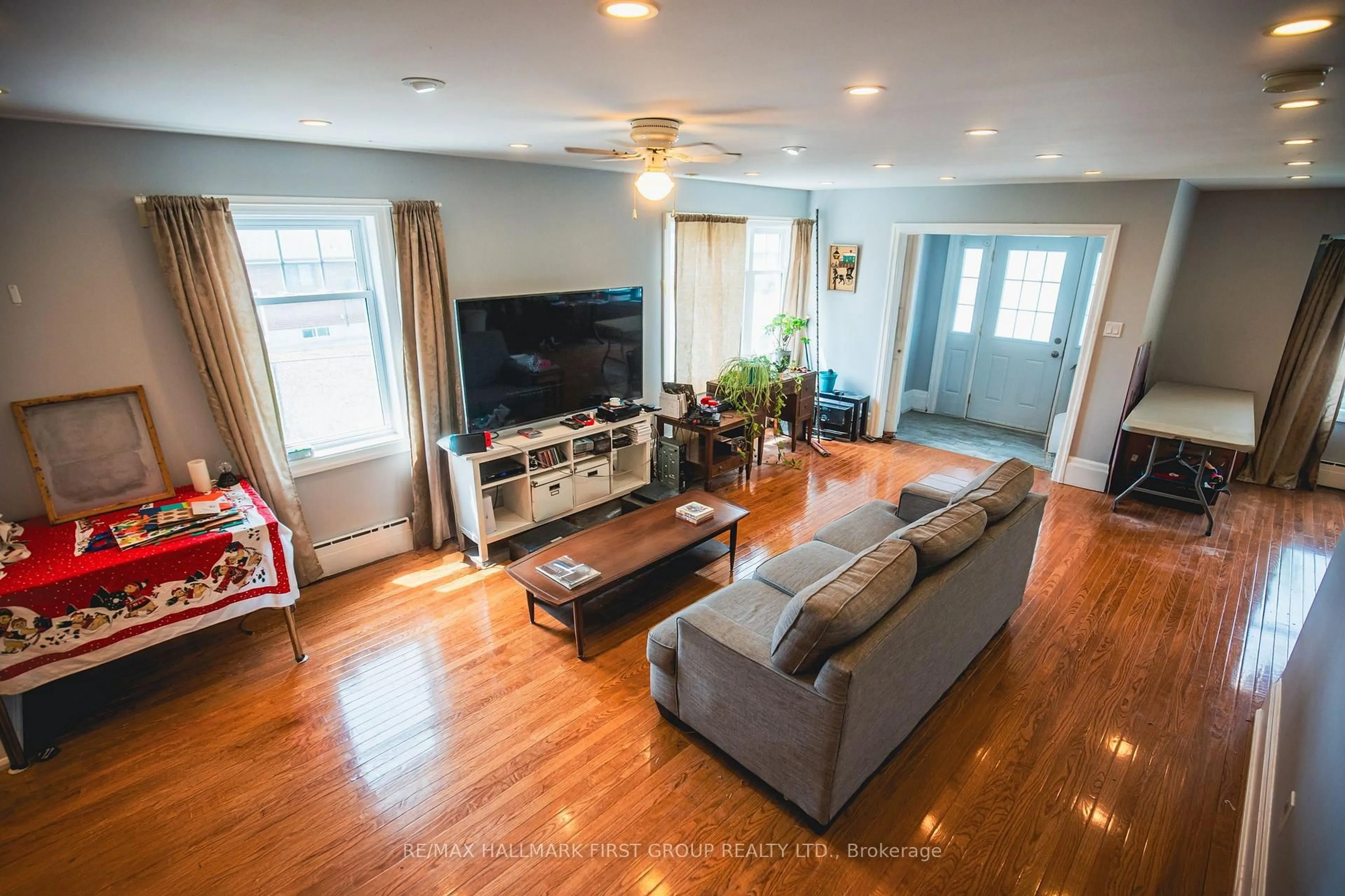 Living room with furniture, wood/laminate floor for 57 Wendell Ave, Toronto Ontario M9N 3K8