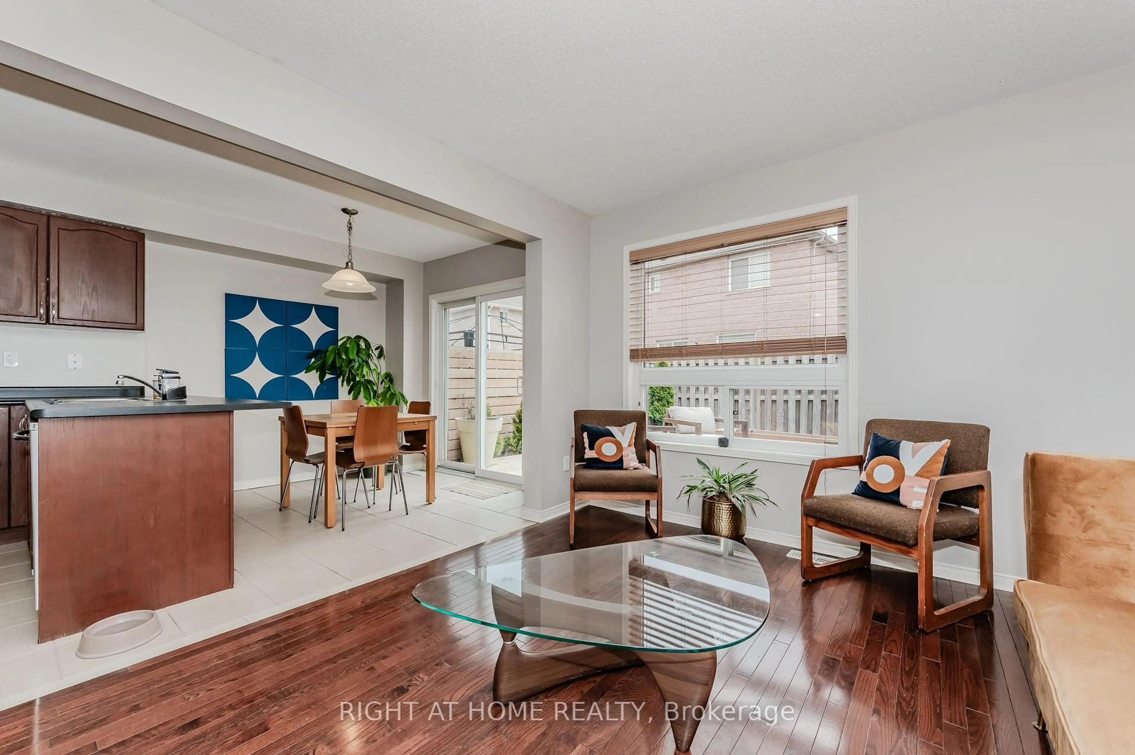 Living room with furniture, wood/laminate floor for 22 Albery Rd, Brampton Ontario L7A 0K7