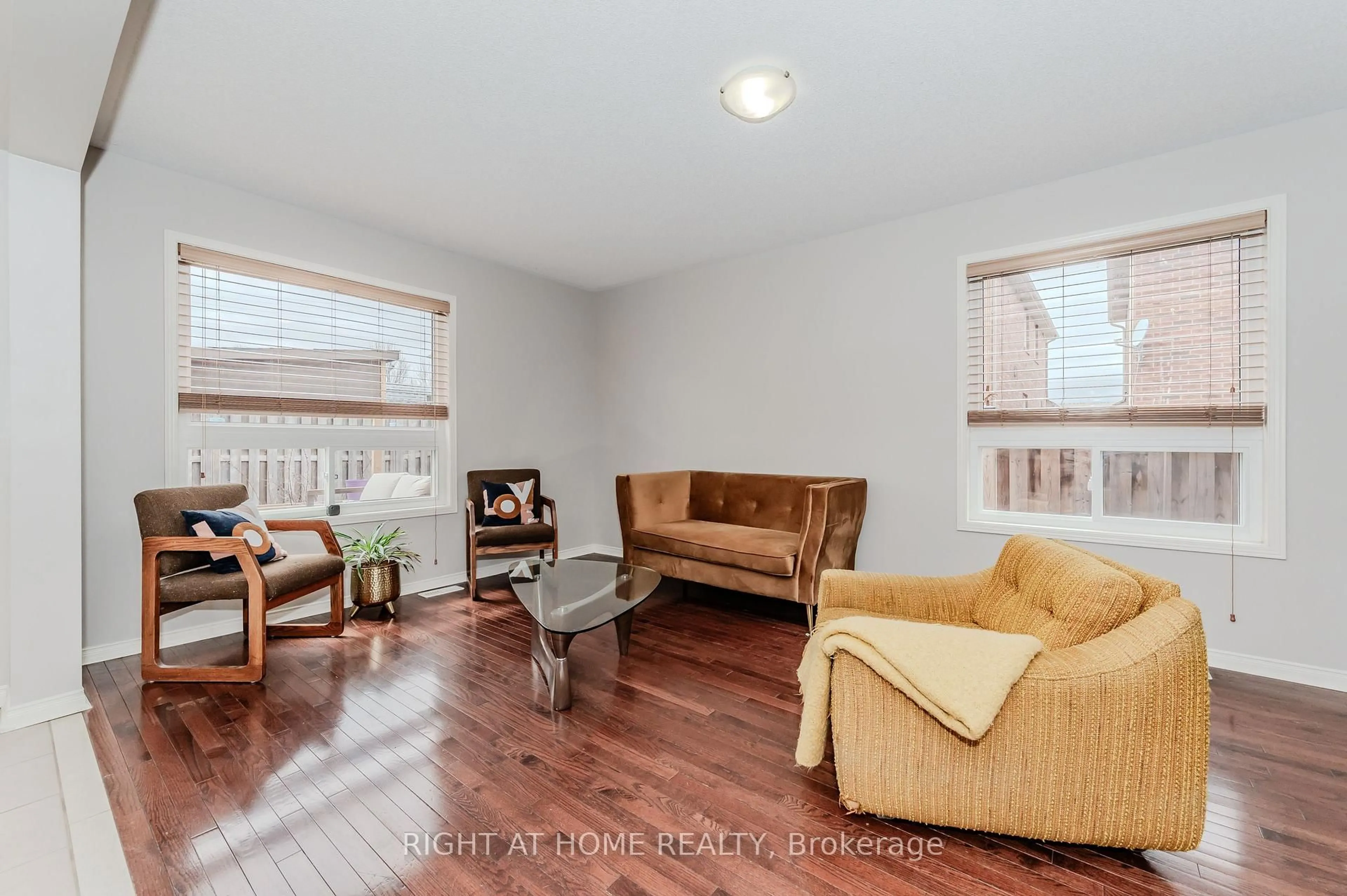 Living room with furniture, wood/laminate floor for 22 Albery Rd, Brampton Ontario L7A 0K7