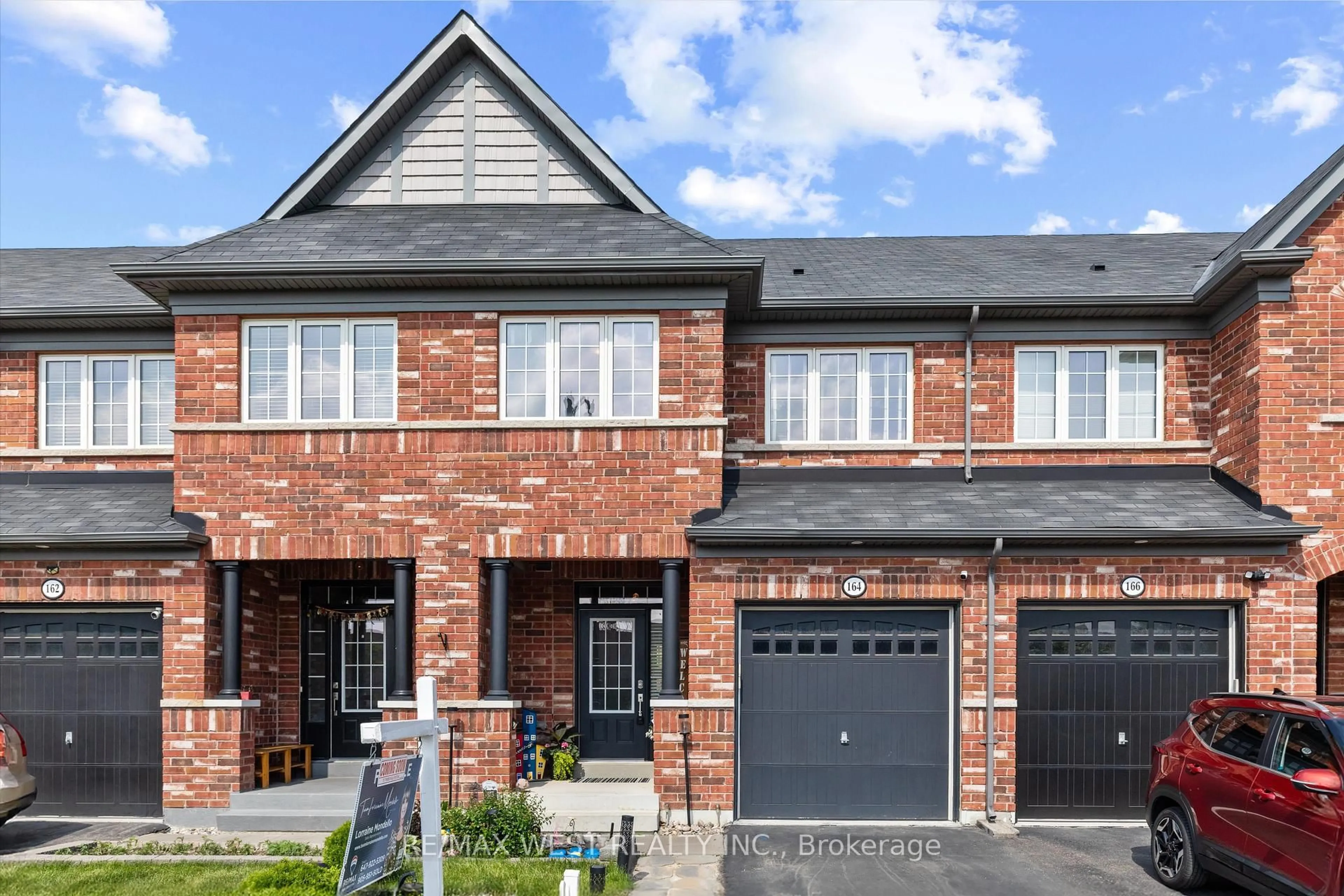 Home with brick exterior material, street for 164 Sussexvale Dr, Brampton Ontario L6R 3R2