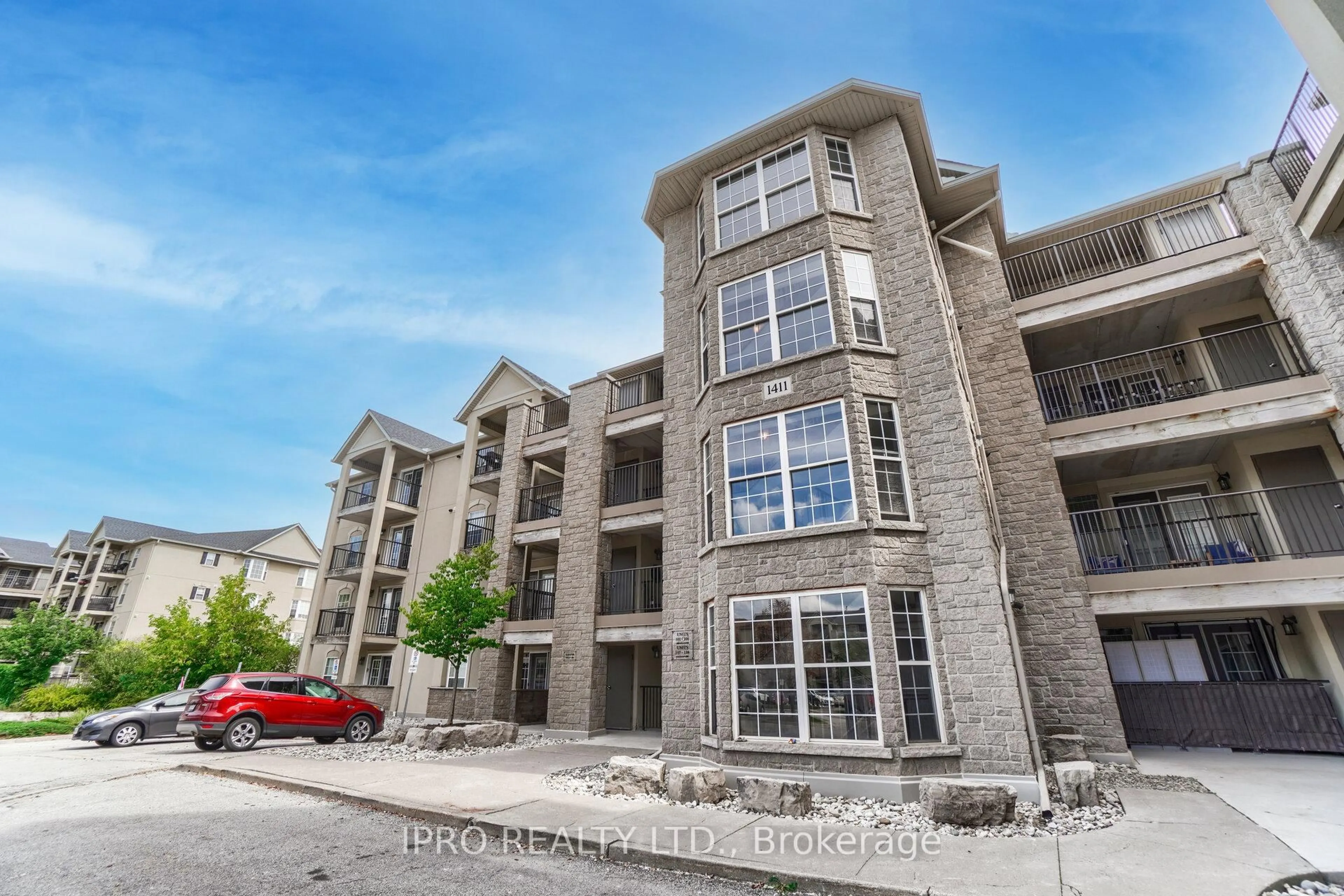 A pic from outside/outdoor area/front of a property/back of a property/a pic from drone, building for 1411 Walker's Line #406, Burlington Ontario L7M 4P5