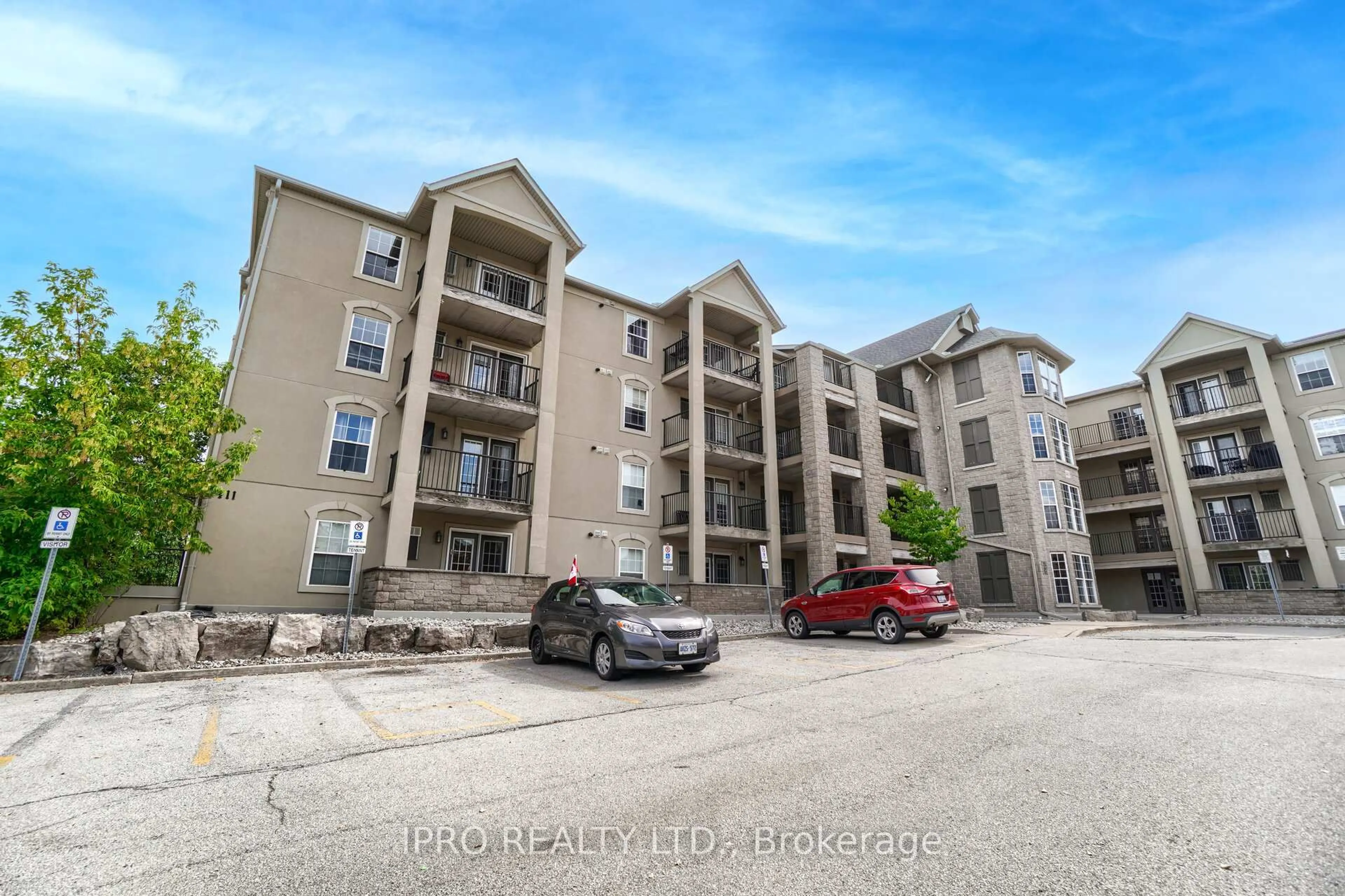 A pic from outside/outdoor area/front of a property/back of a property/a pic from drone, unknown for 1411 Walker's Line #406, Burlington Ontario L7M 4P5