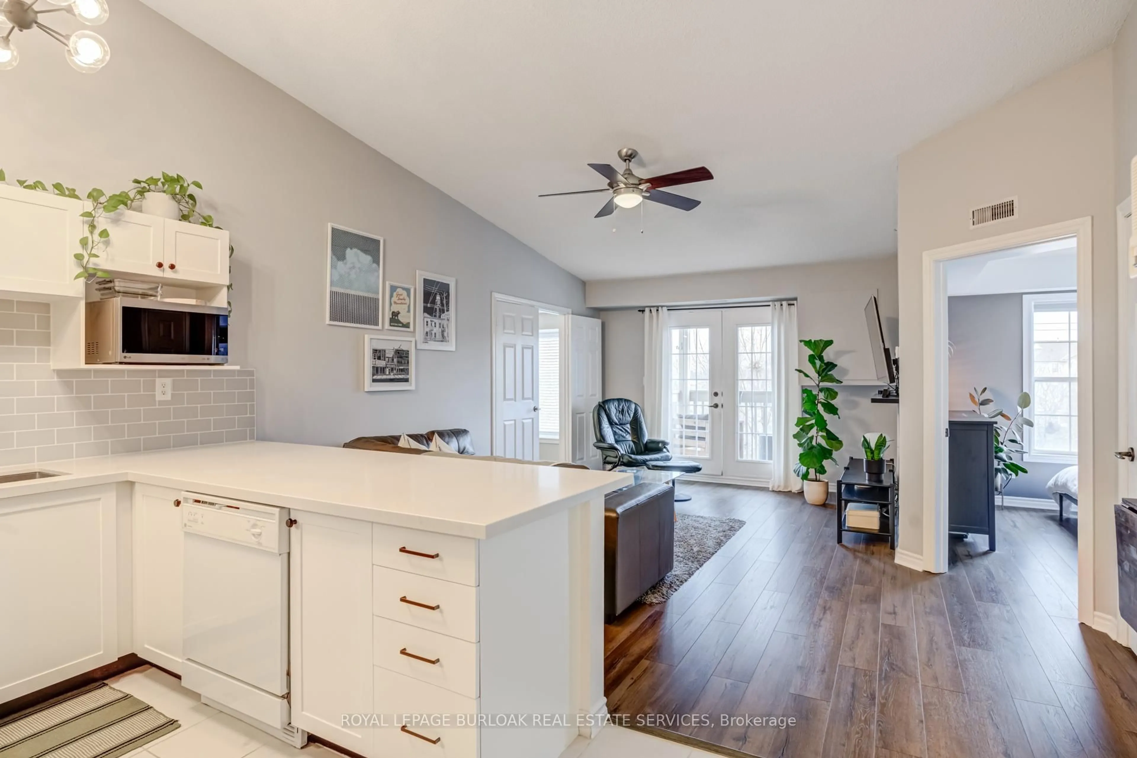 Open concept kitchen, wood/laminate floor for 4003 Kilmer Dr #403, Burlington Ontario L7M 4M1
