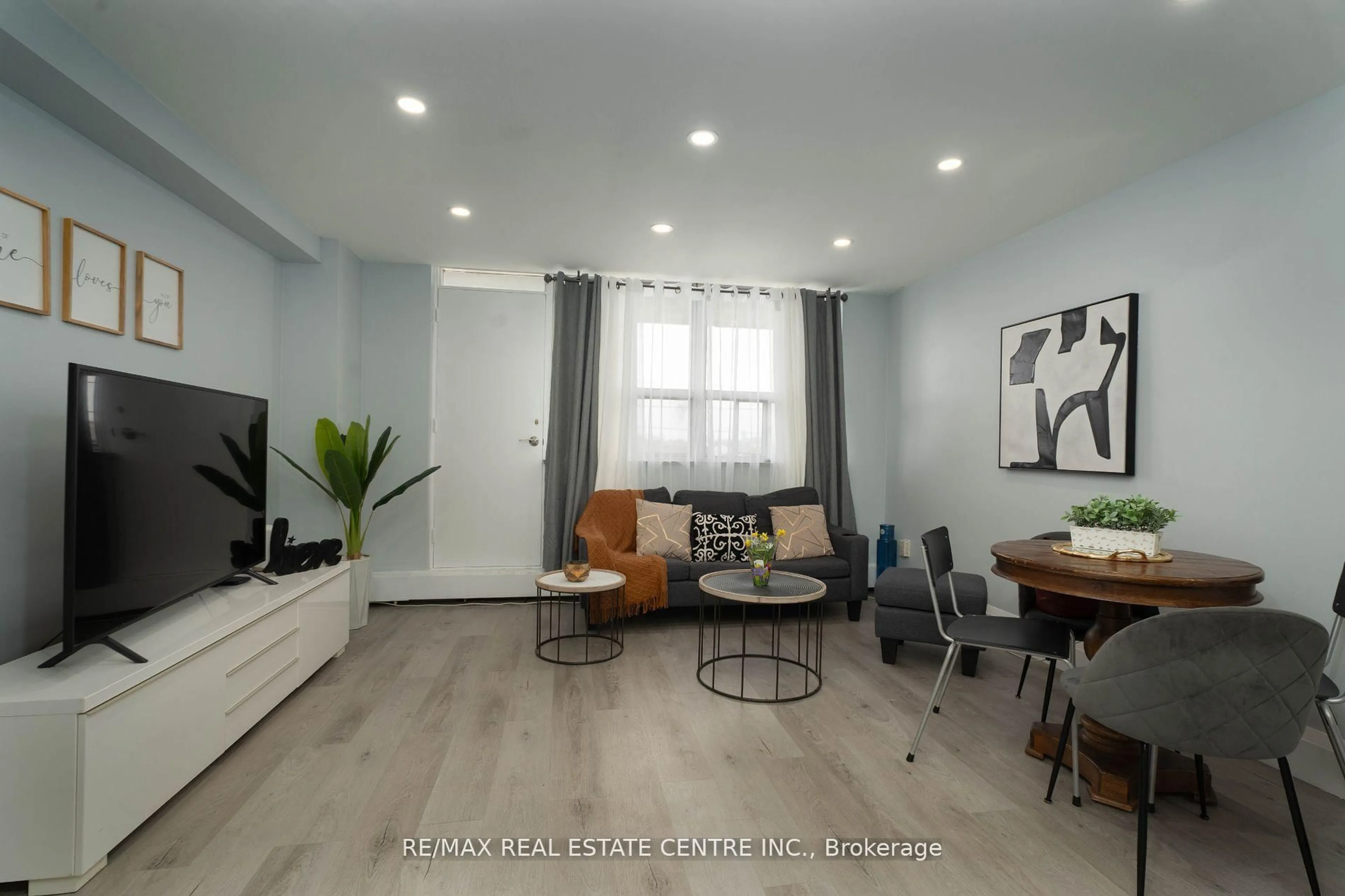 Living room with furniture, wood/laminate floor for 3621 Lakeshore Blvd #504, Toronto Ontario M8W 4W1