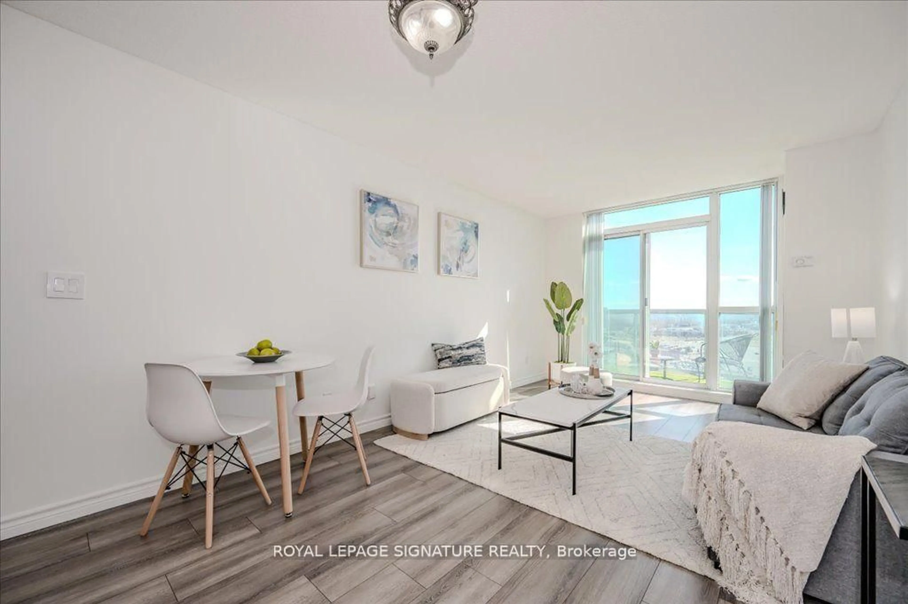 Living room with furniture, wood/laminate floor for 2545 Erin Centre Blvd #PH 05, Mississauga Ontario L5M 5H6