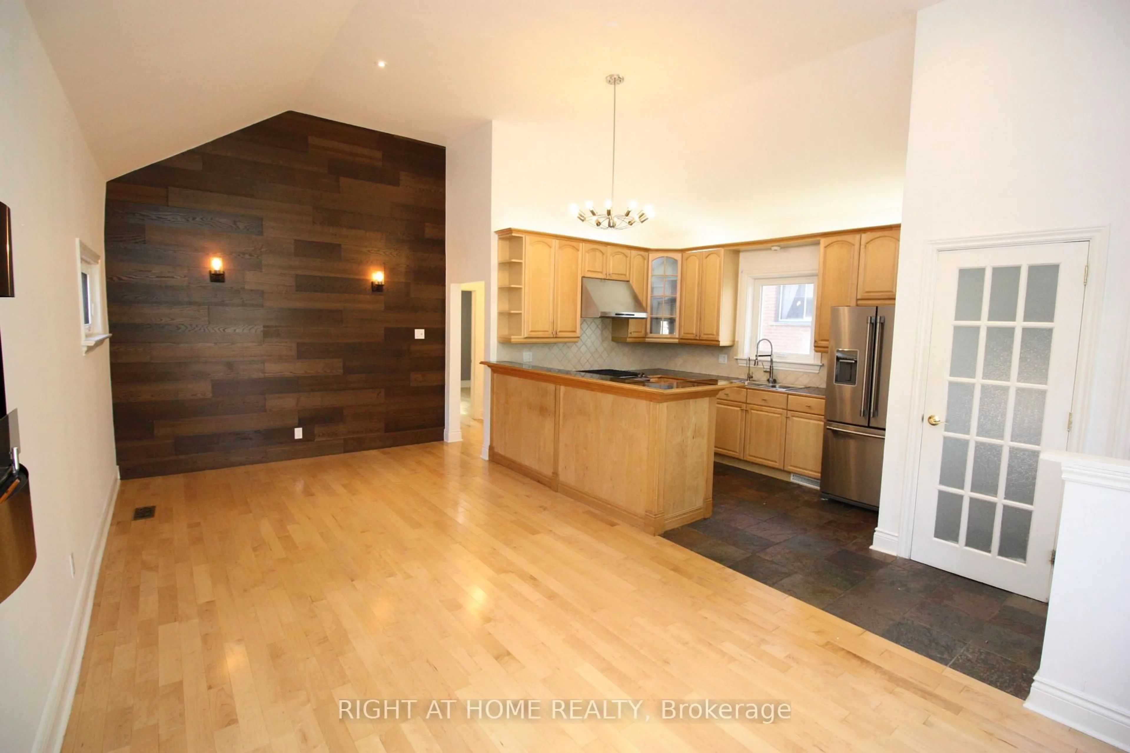 Open concept kitchen, wood/laminate floor for 479 Rimilton Ave, Toronto Ontario M8W 2H2
