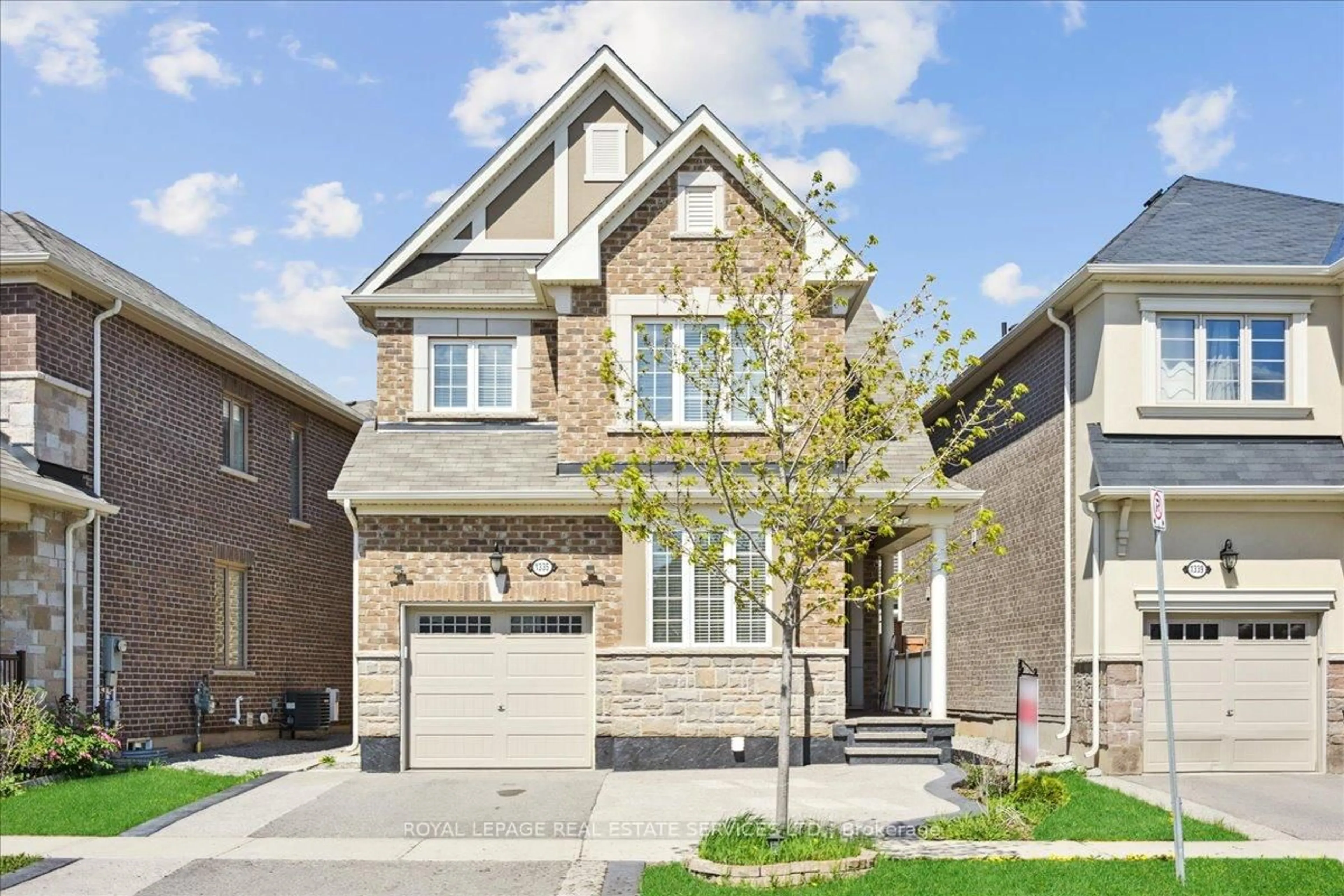 Home with brick exterior material, street for 1335 Rose Way, Milton Ontario L9E 1M5