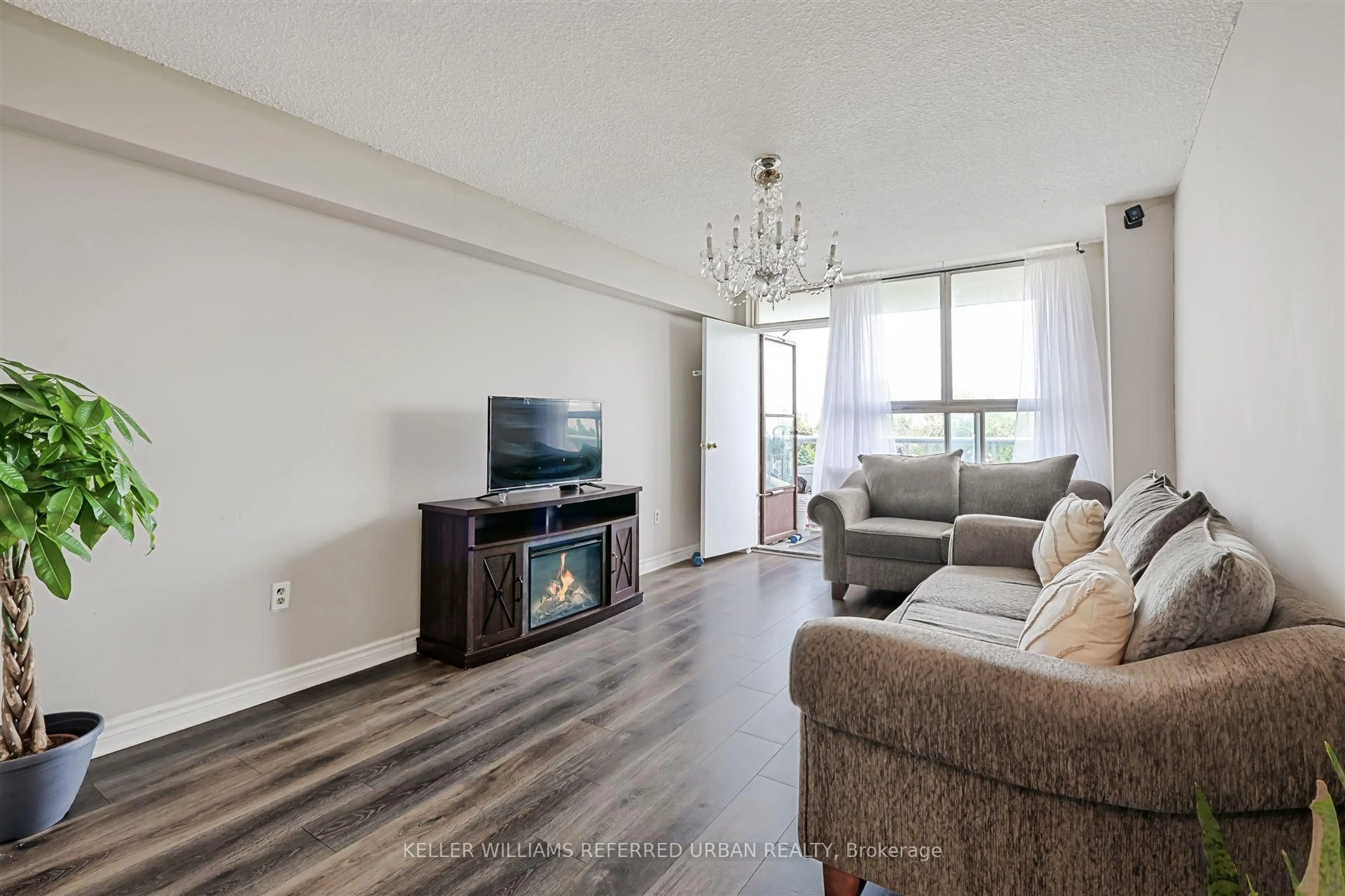 Living room with furniture, wood/laminate floor for 940 Caledonia Rd #611, Toronto Ontario M6B 2G8