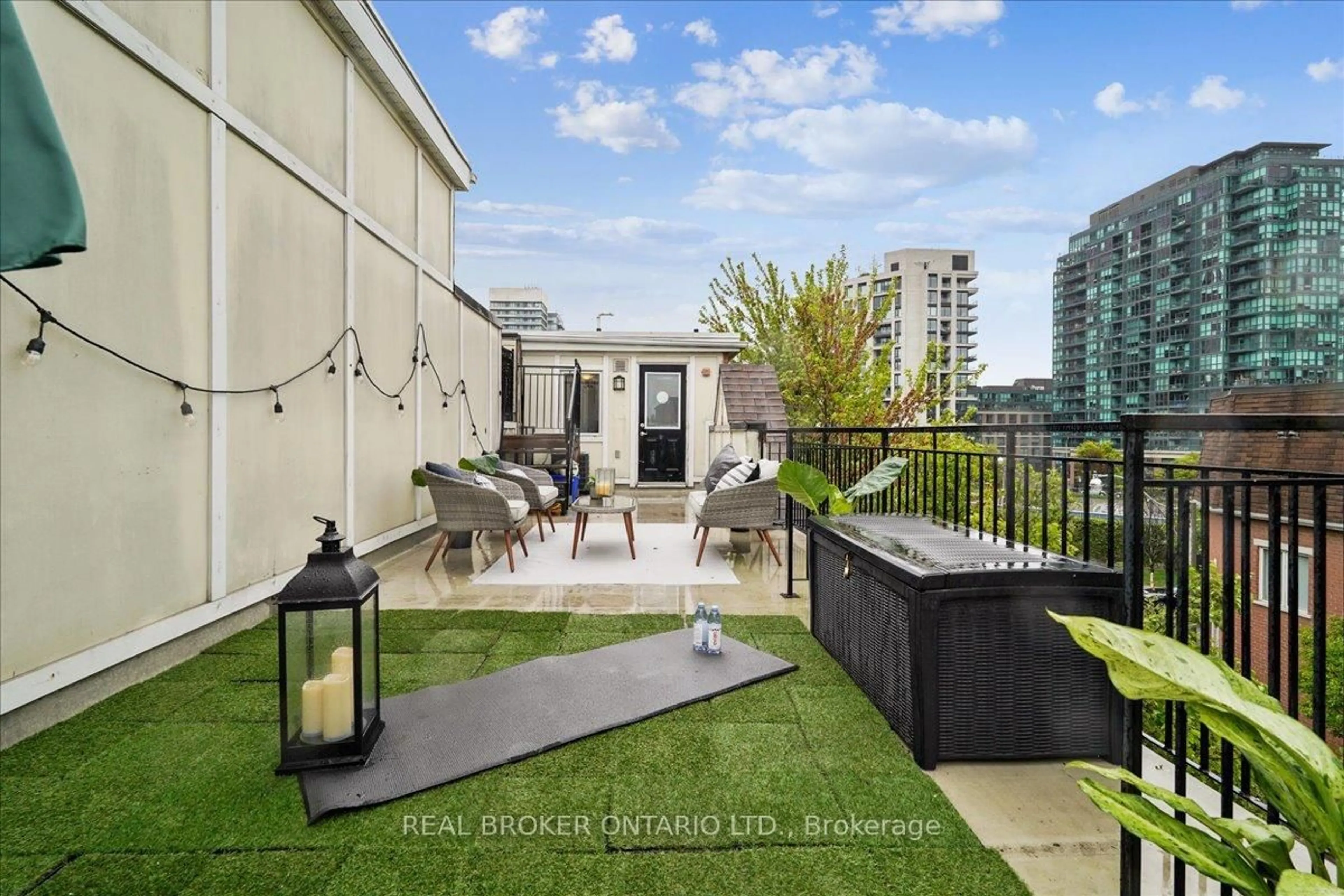 Patio, city buildings view from balcony for 22 Laidlaw St #1233C, Toronto Ontario M6K 1X2