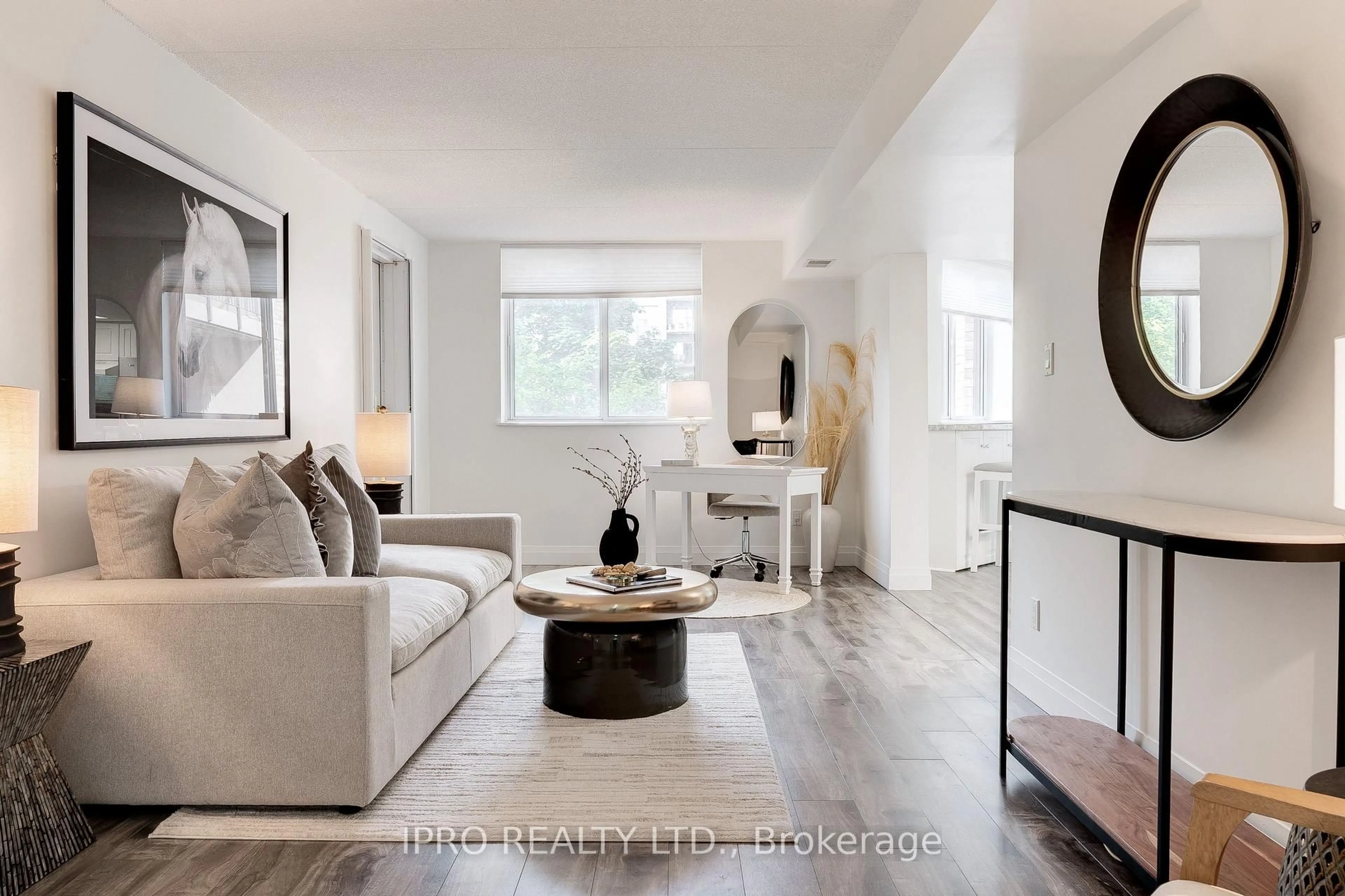 Living room with furniture, wood/laminate floor for 3499 Upper Middle Rd #211, Burlington Ontario L7M 4M7