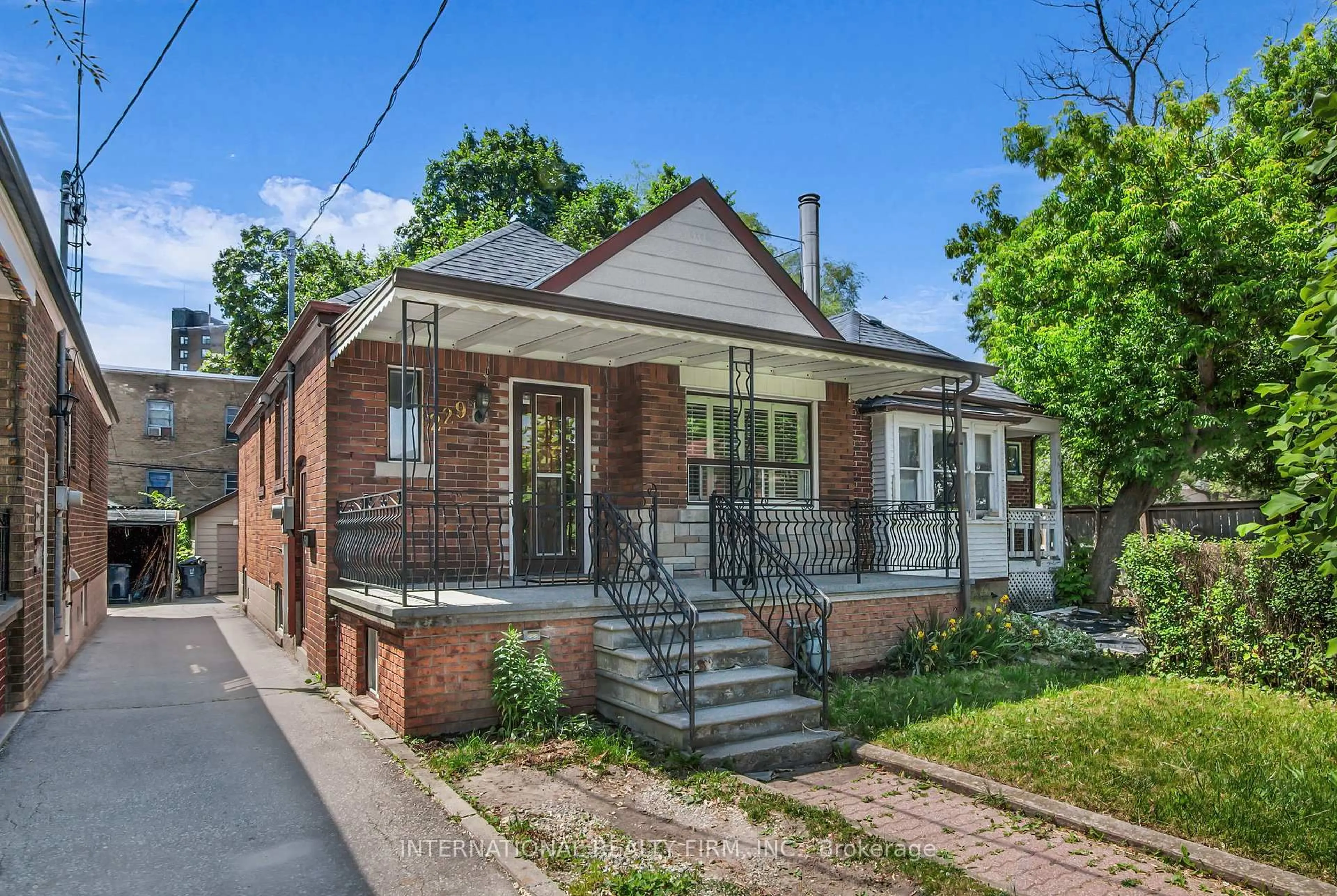 Home with brick exterior material, street for 229 Livingstone Ave, Toronto Ontario M6E 2M3