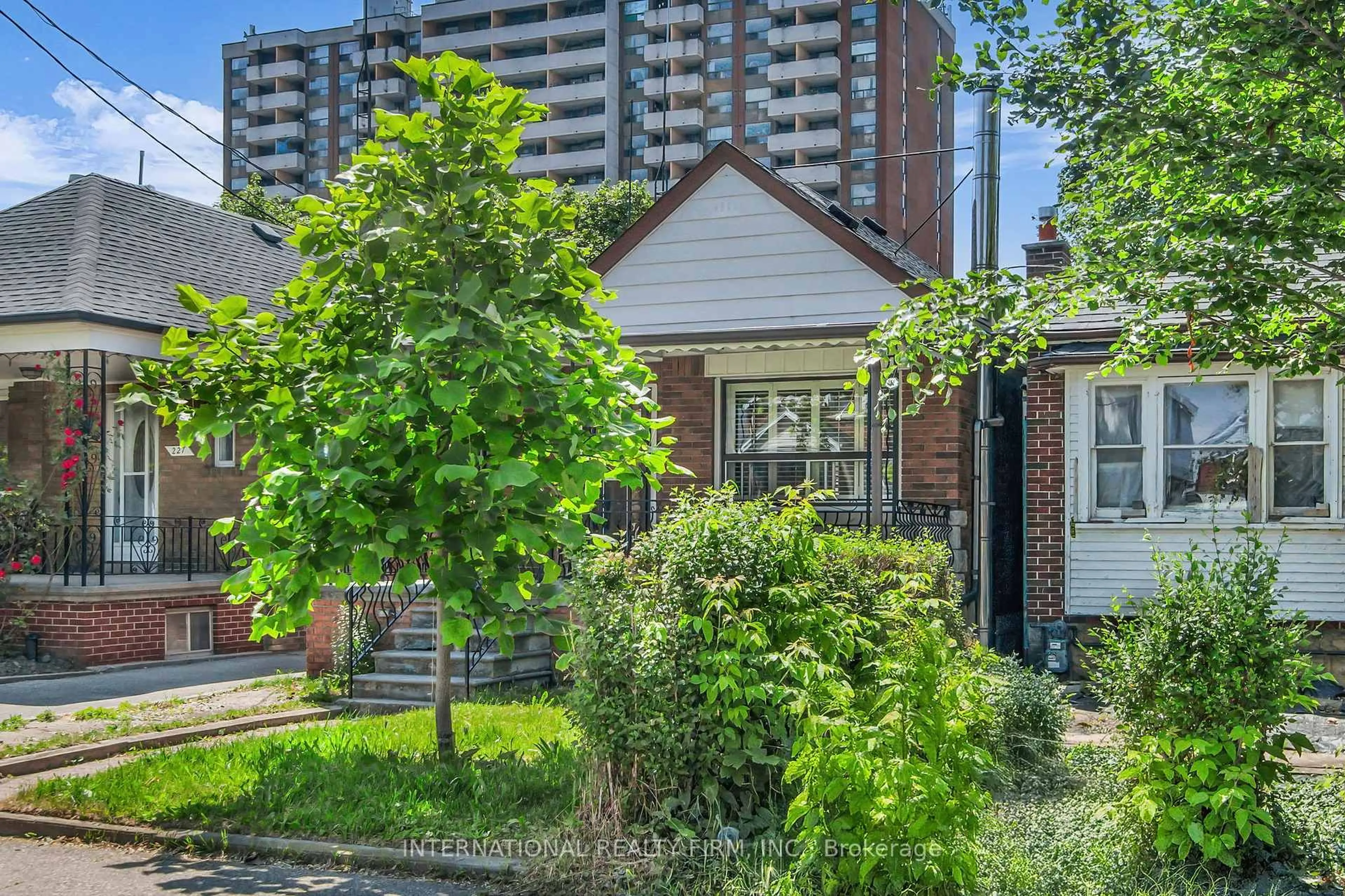 Home with brick exterior material, street for 229 Livingstone Ave, Toronto Ontario M6E 2M3