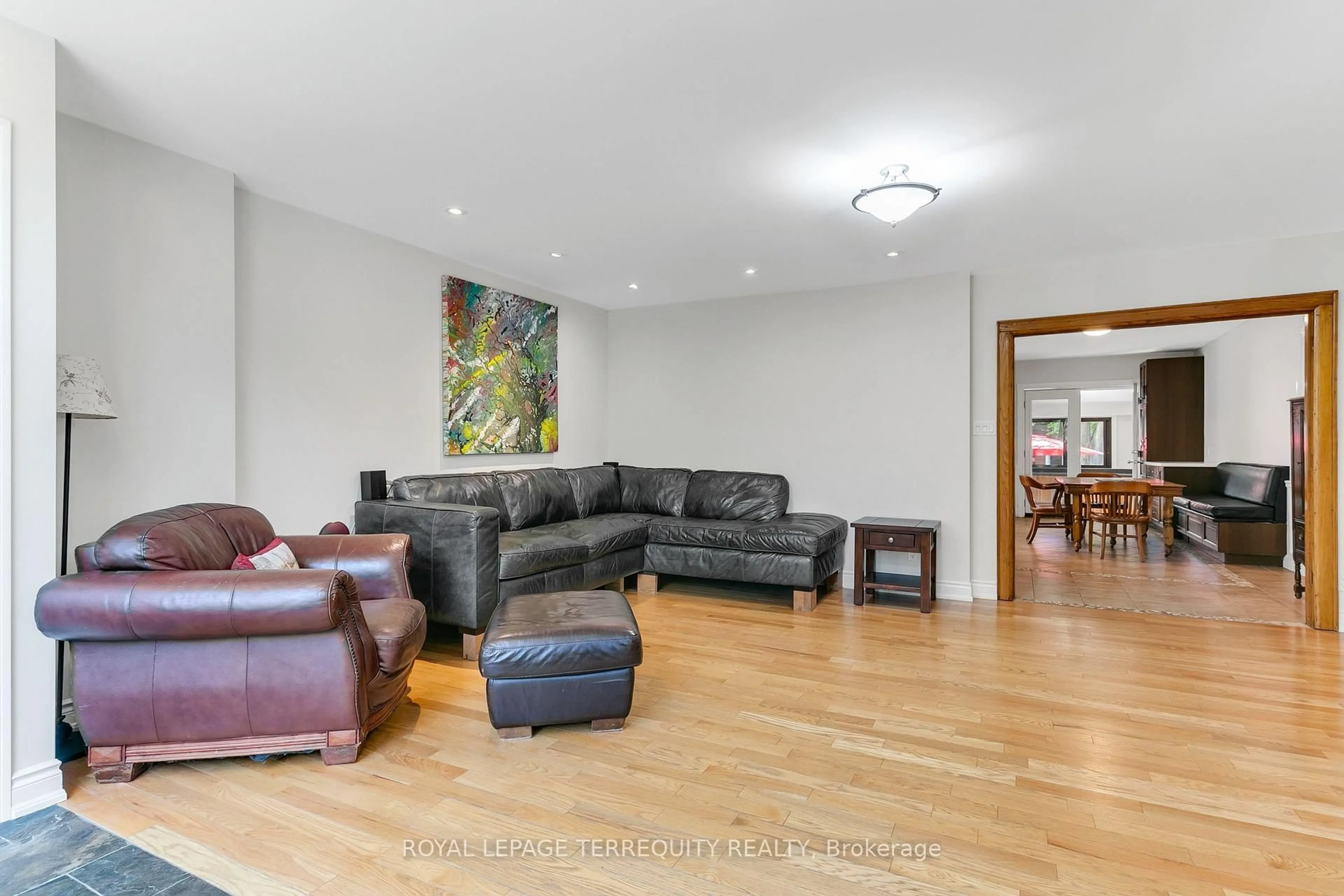 Living room with furniture, wood/laminate floor for 57 Primrose Ave, Toronto Ontario M8V 1P7