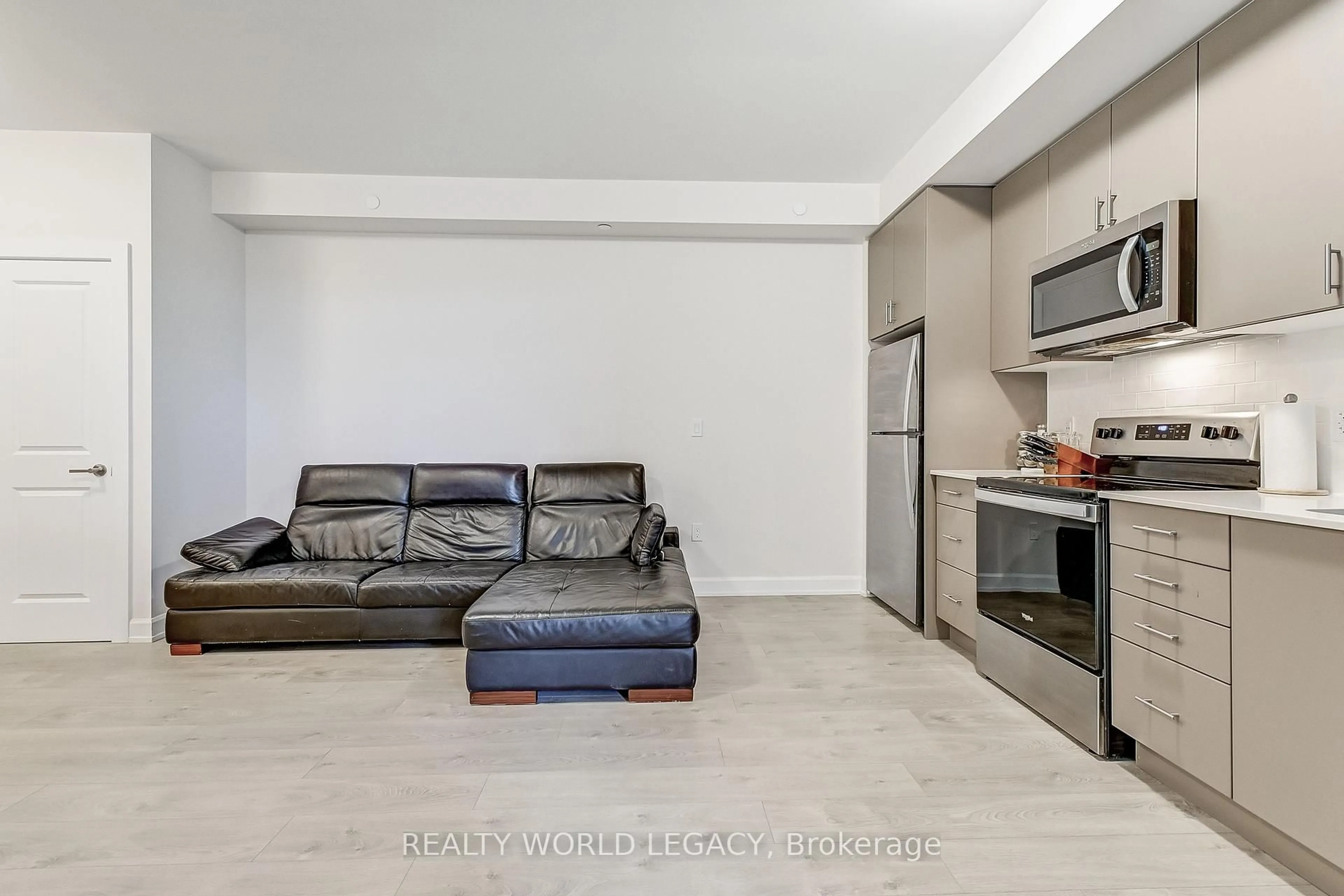 Living room with furniture, unknown for 3200 William Coltson Ave #401, Oakville Ontario L6H 7W6