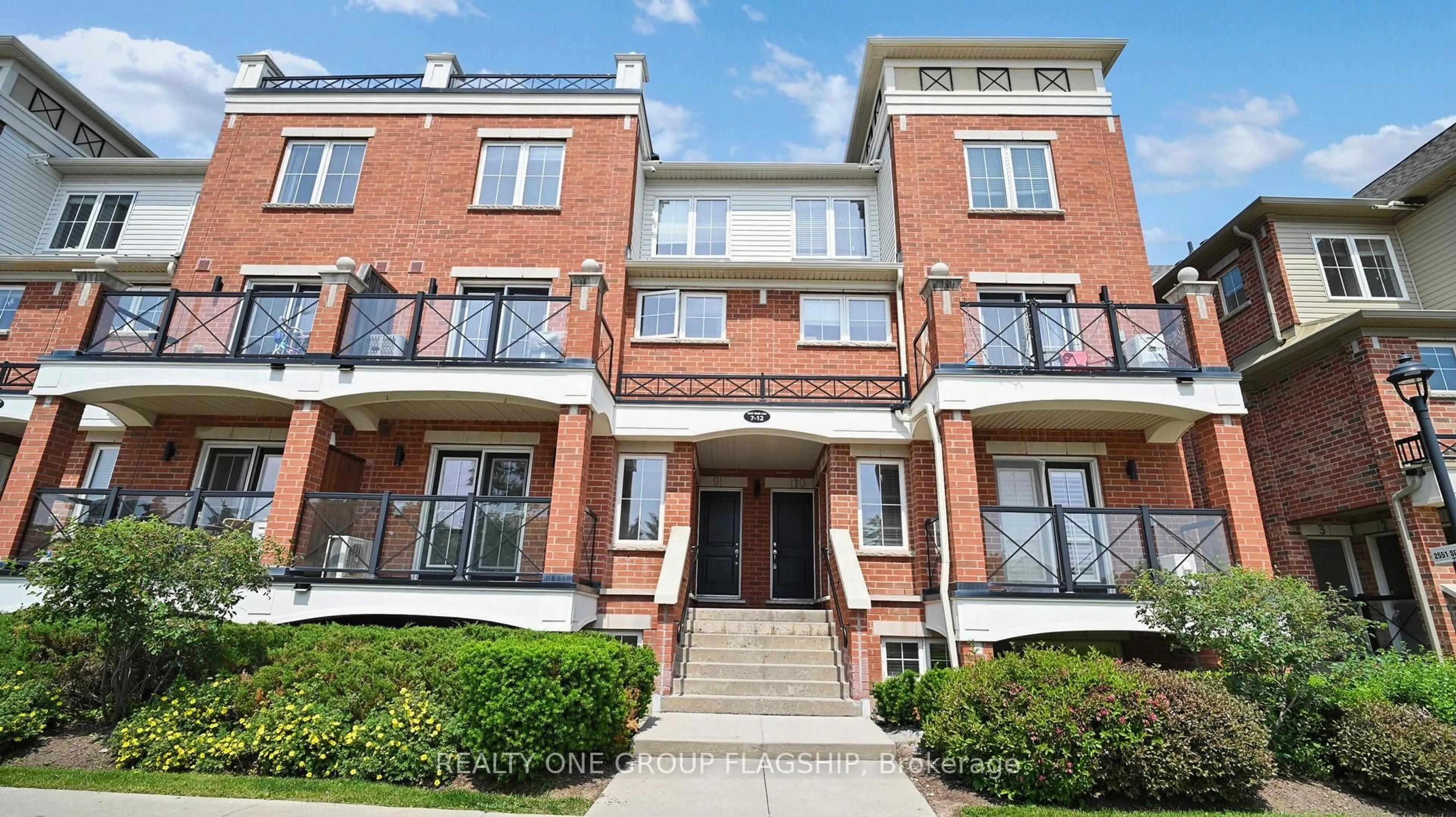 Home with brick exterior material, street for 2557 Sixth Line #10, Oakville Ontario L6H 0H7