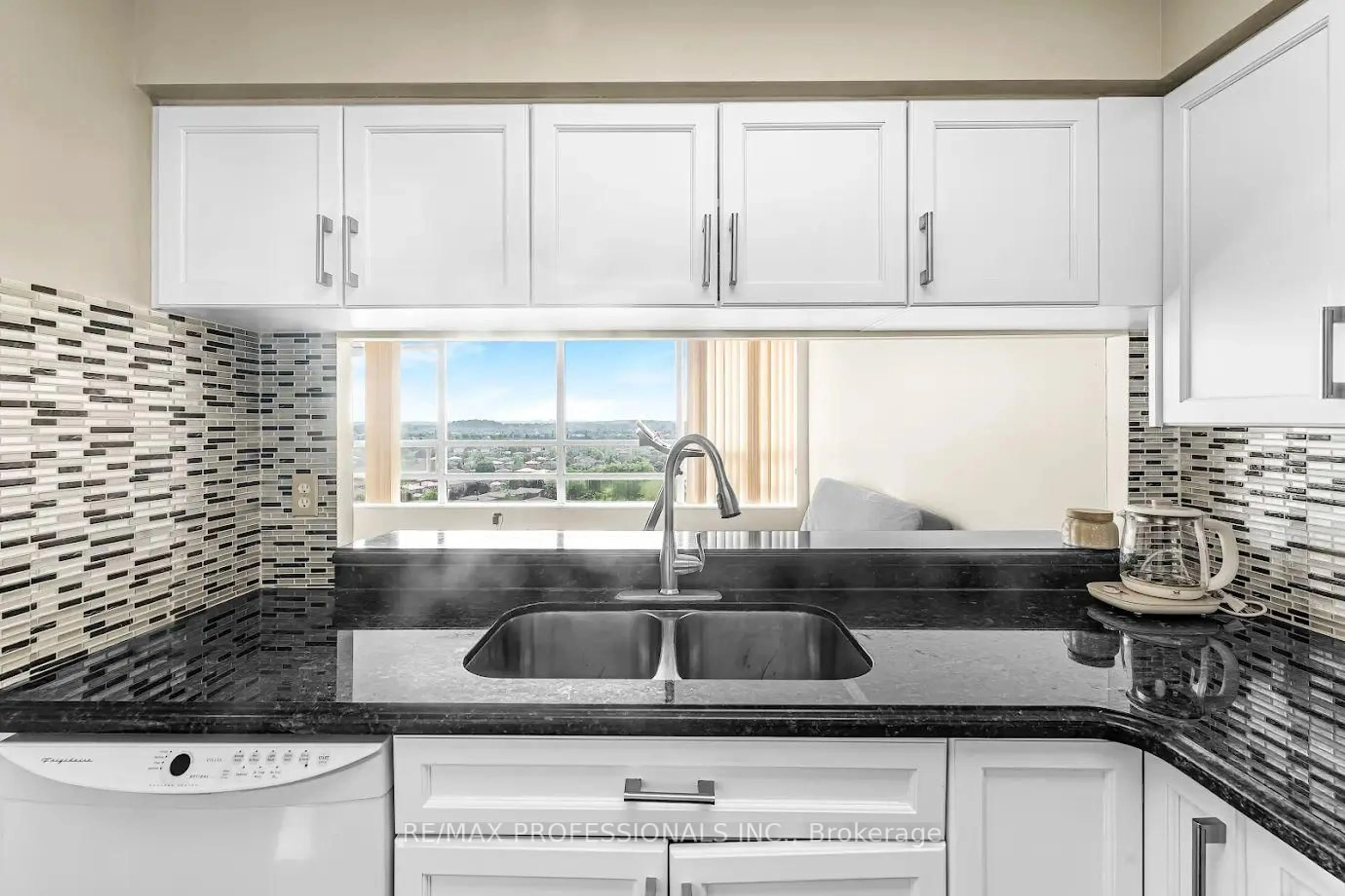 Standard kitchen, ceramic/tile floor for 50 Kingsbridge Garden Circ #1502, Mississauga Ontario L5R 1Y2