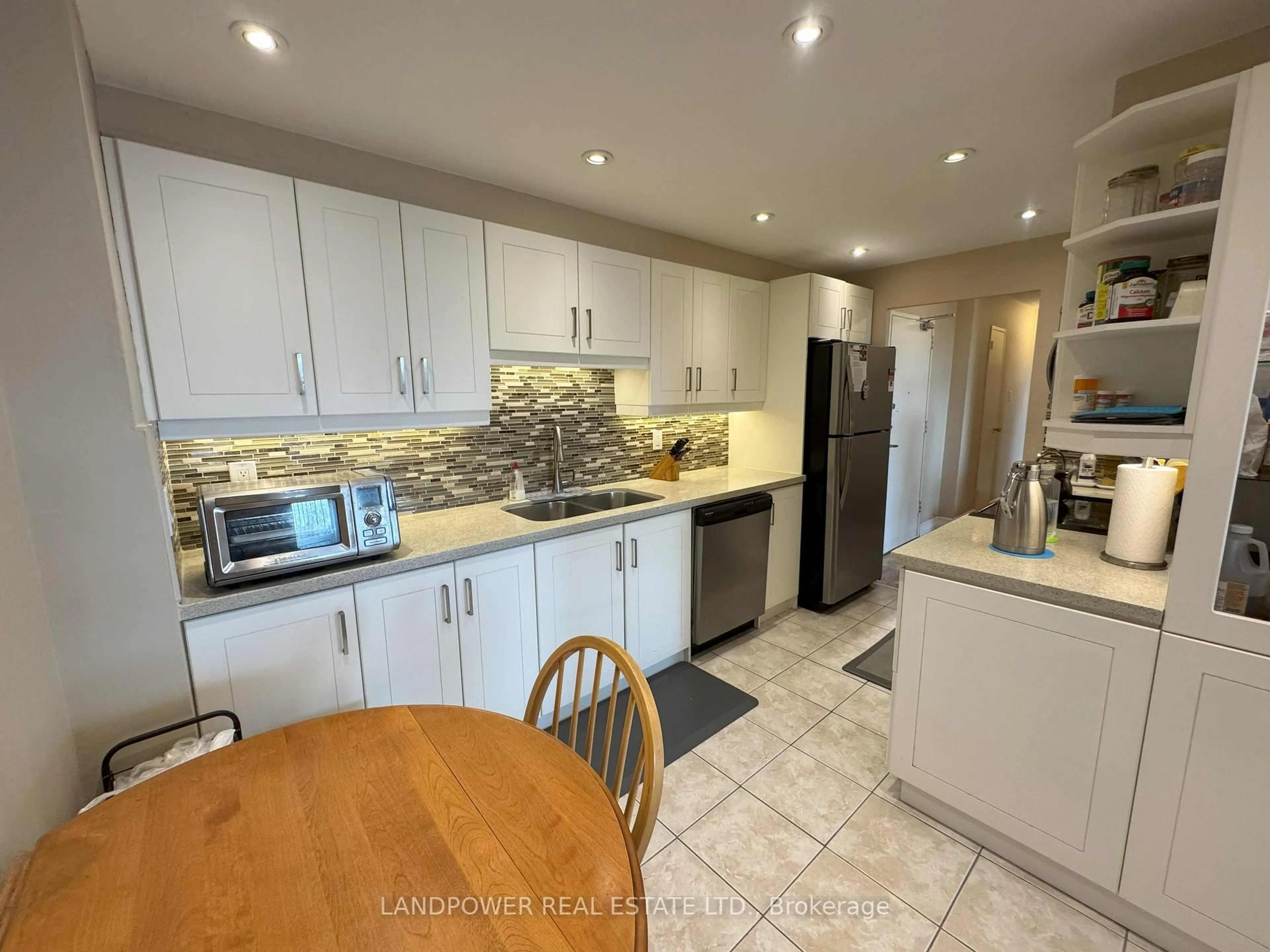 Open concept kitchen, ceramic/tile floor for 625 The West Mall #303, Toronto Ontario M9C 4W9