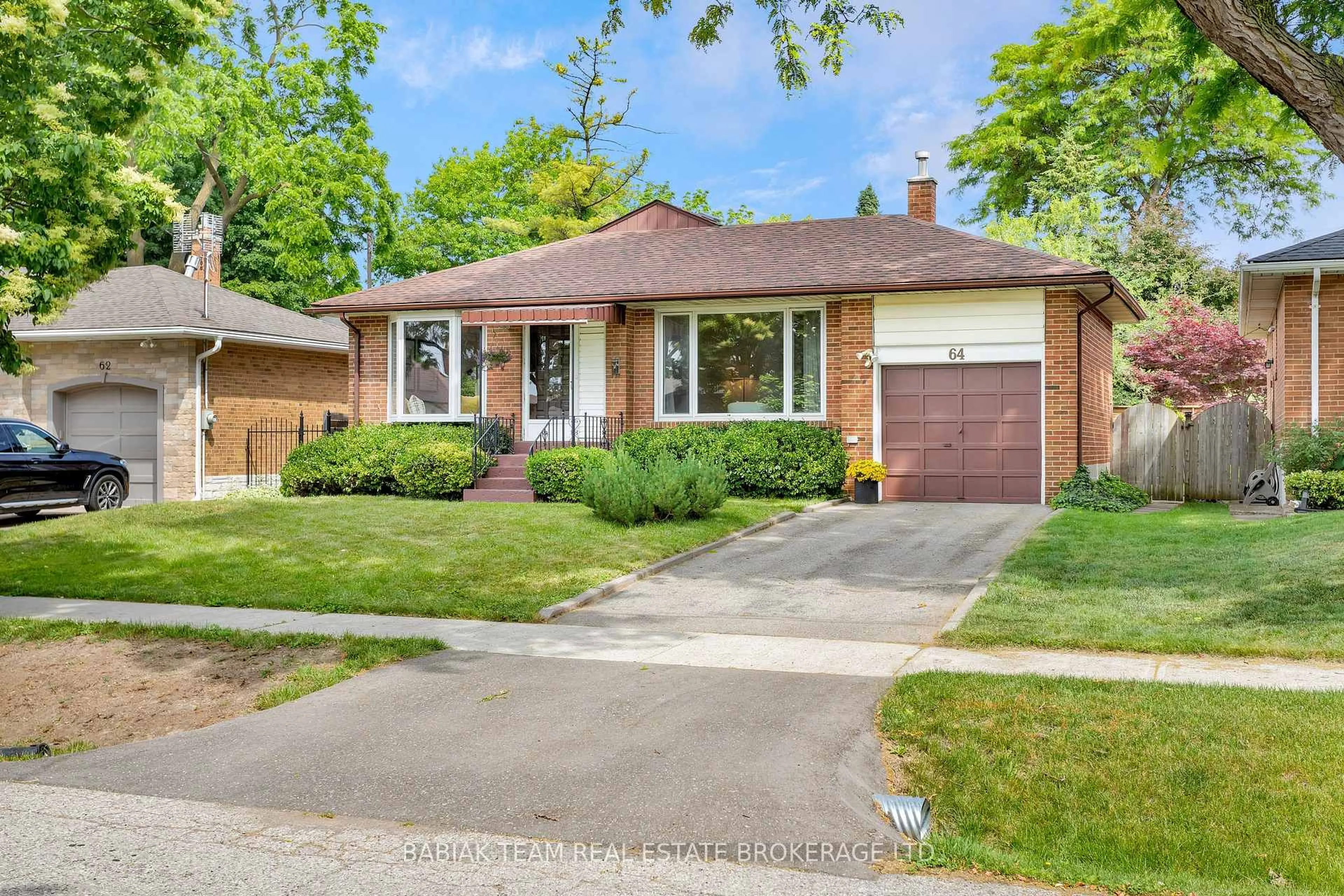 Home with brick exterior material, street for 64 Mooreshead Dr, Toronto Ontario M9C 2S3