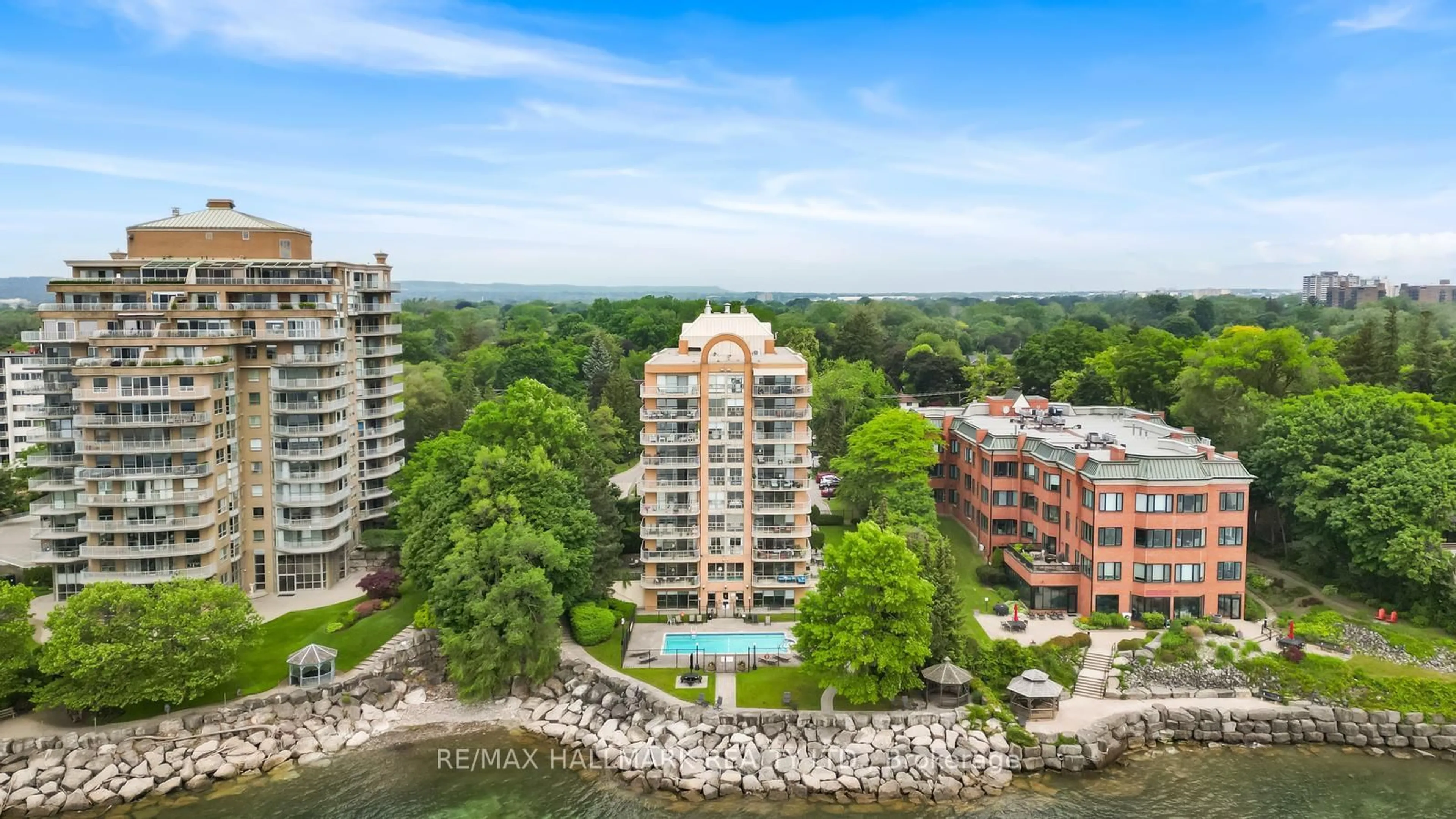A pic from outside/outdoor area/front of a property/back of a property/a pic from drone, water/lake/river/ocean view for 2210 Lakeshore Rd #104, Burlington Ontario L7R 4J9