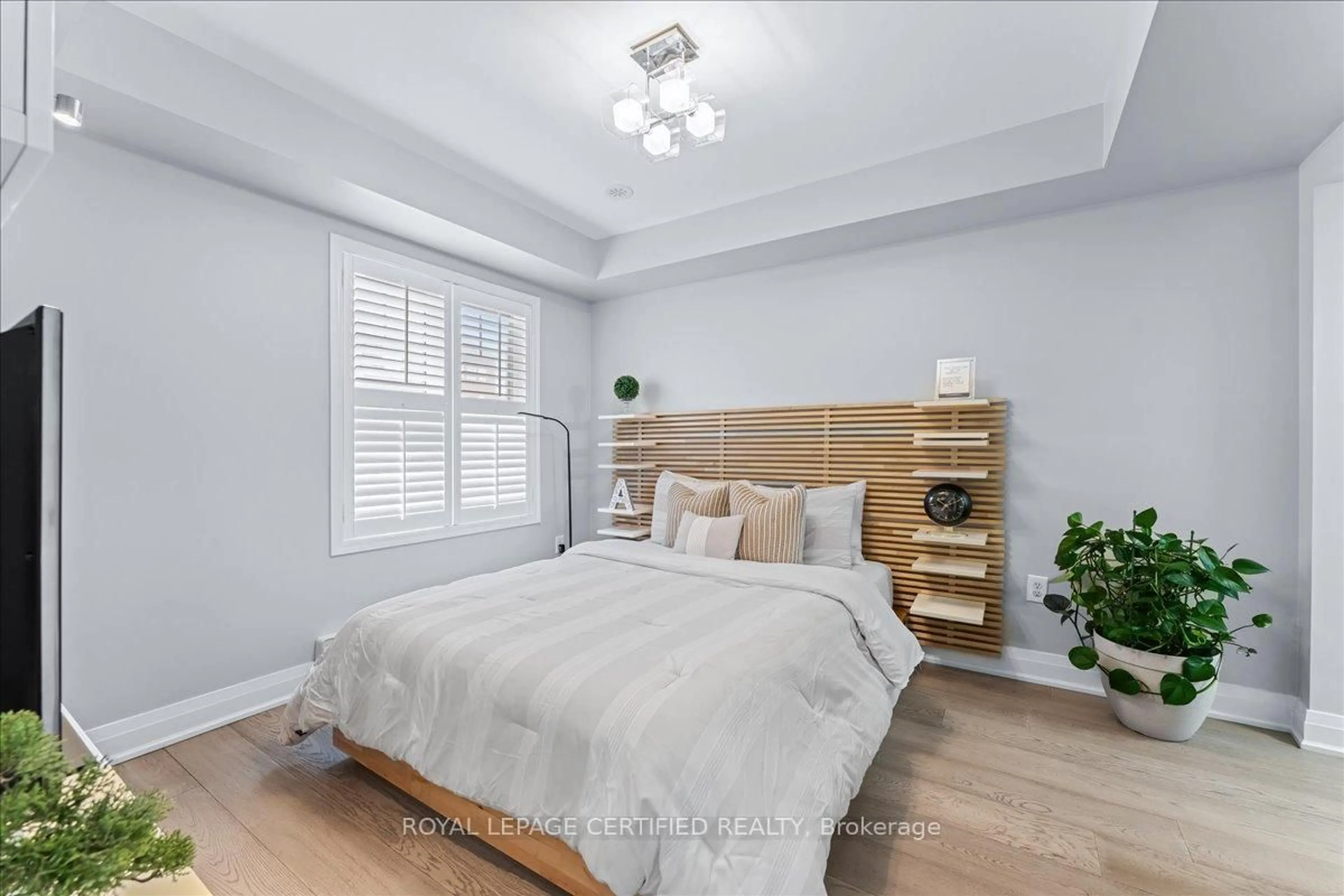 Bedroom with bed, wood/laminate floor for 26 Ganton Hts, Brampton Ontario L7A 0S4
